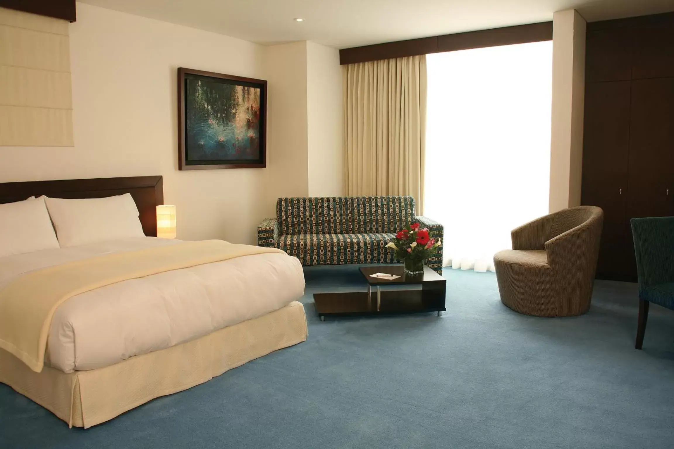 Bed in Blue Suites Hotel