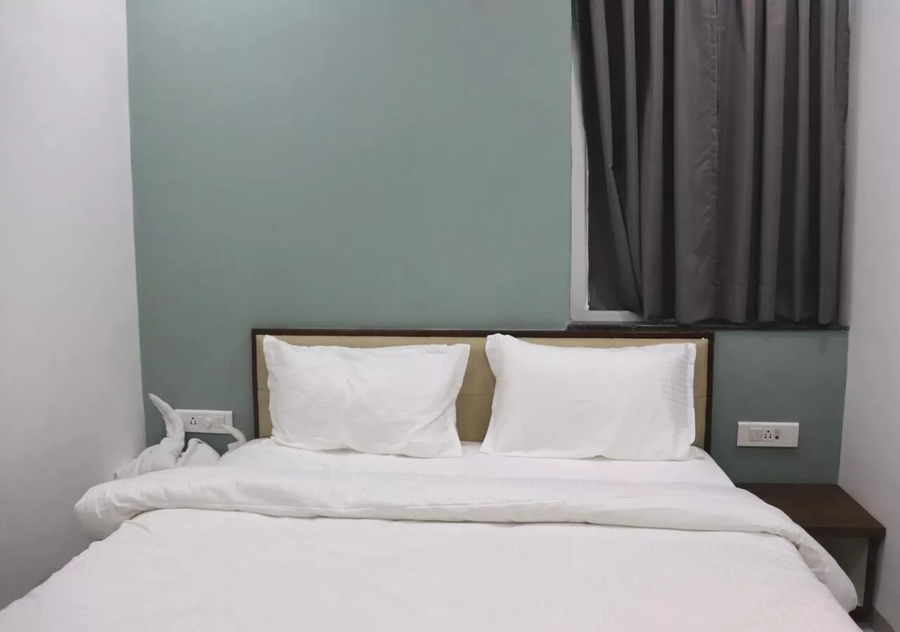 Bedroom in Sharman Suites