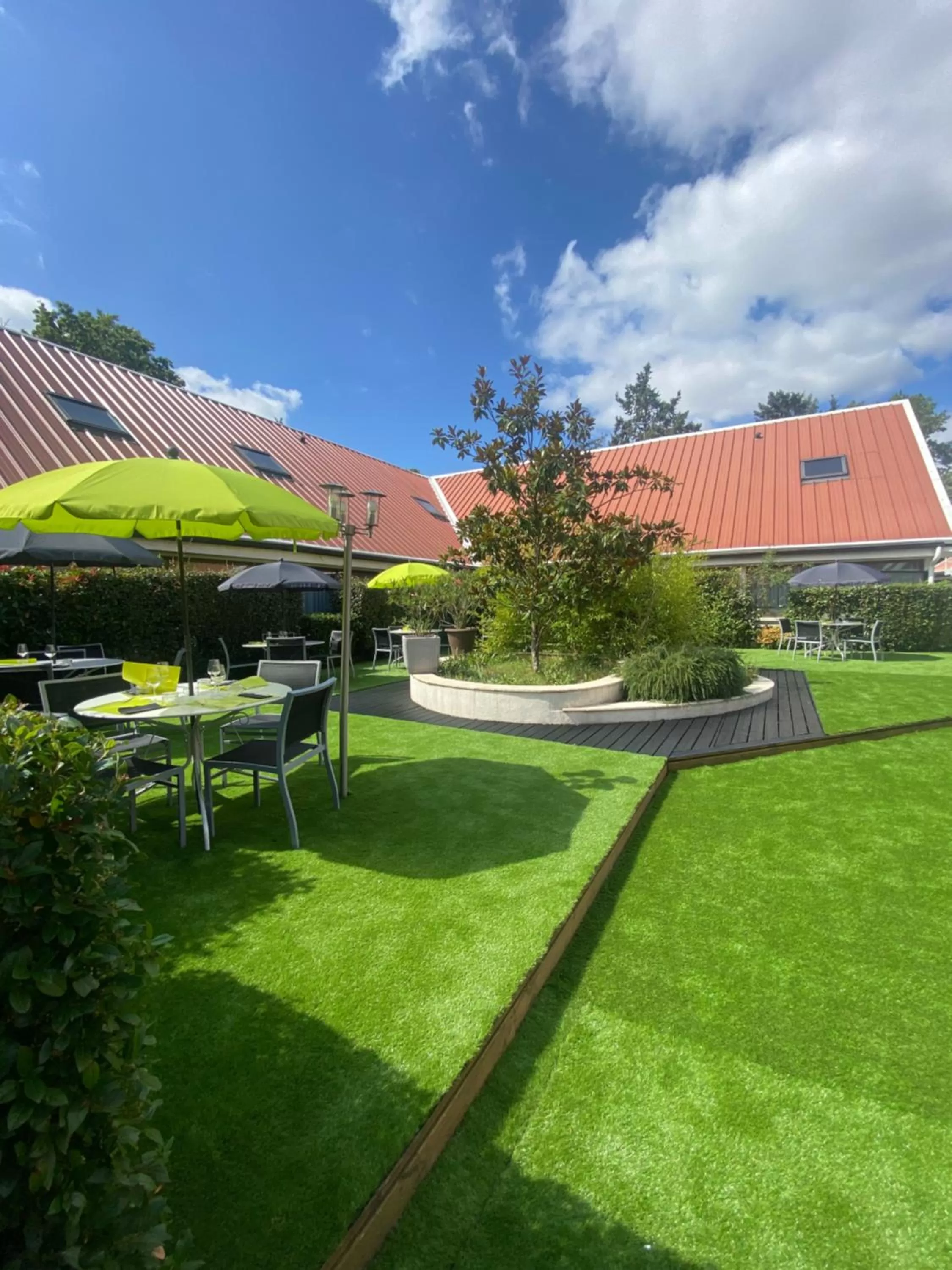 Patio, Garden in Logis Hotel Restaurant Black and Green Limoges Sud