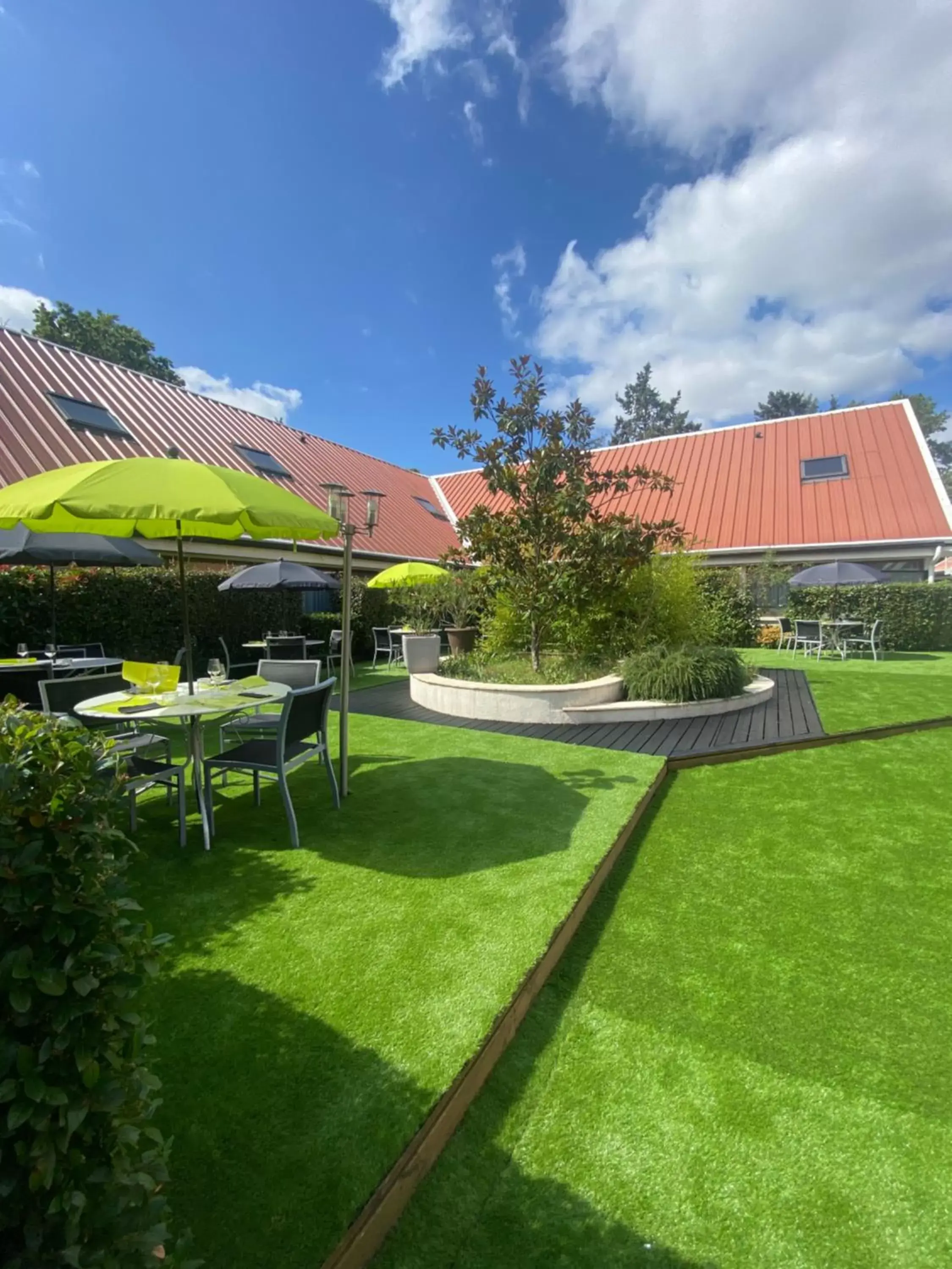 Patio, Garden in Logis Hotel Restaurant Black and Green Limoges Sud