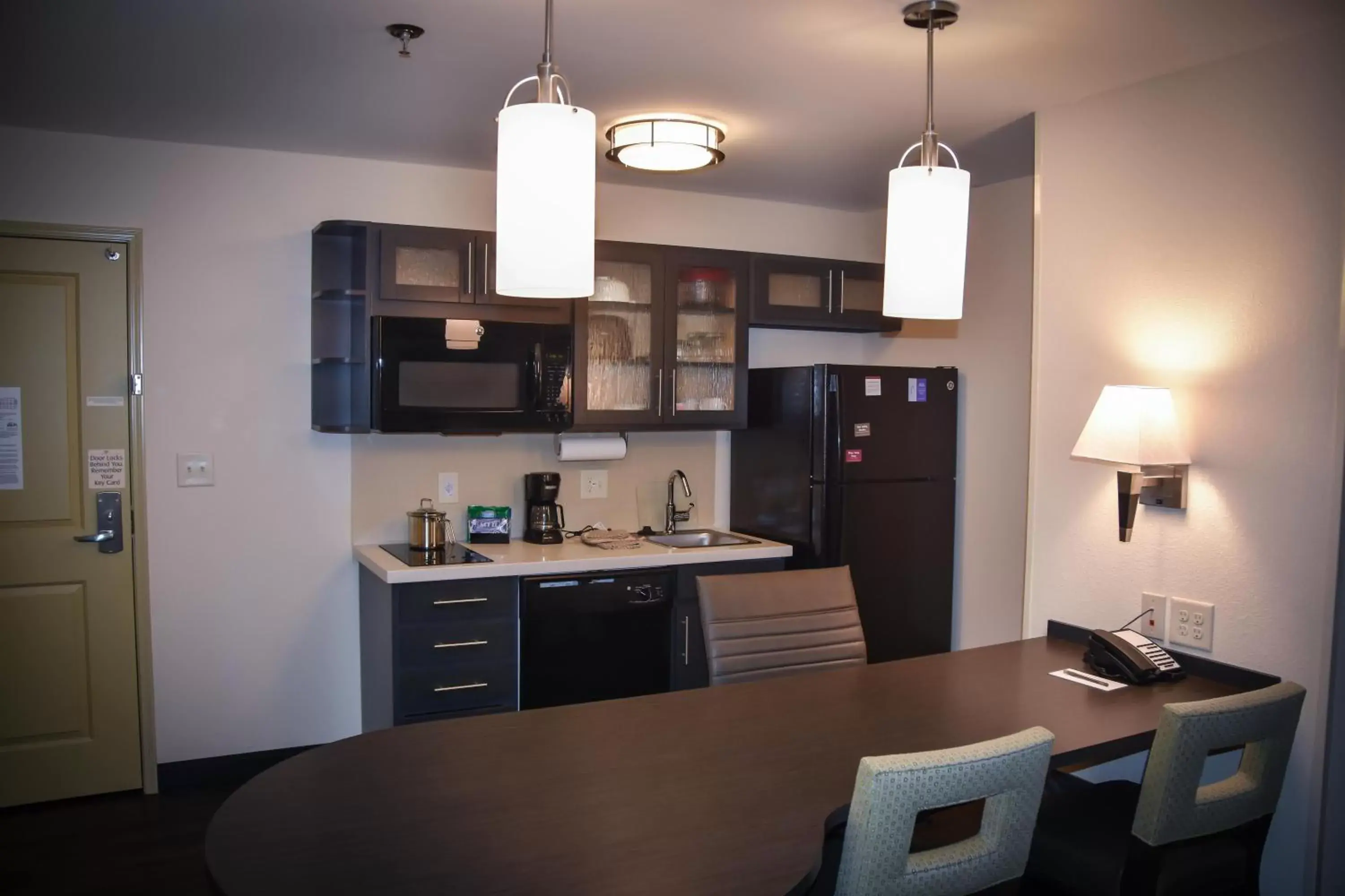 Photo of the whole room, Kitchen/Kitchenette in Candlewood Suites Columbus-Northeast, an IHG Hotel
