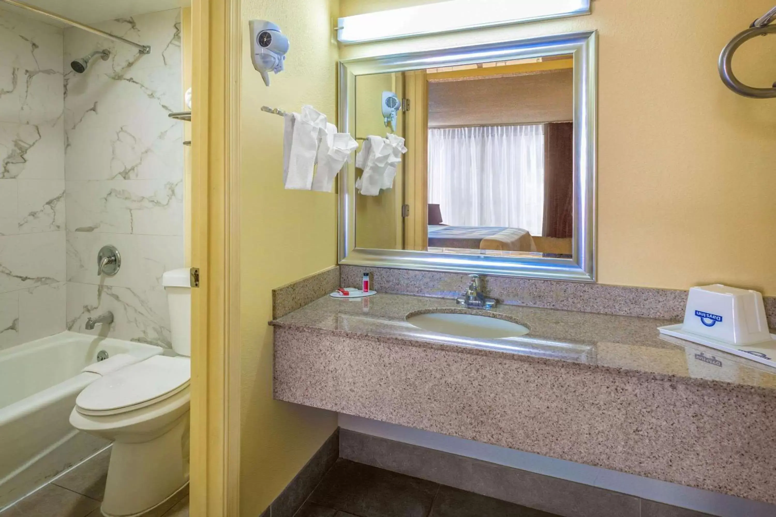 Bathroom in Days Inn by Wyndham Hampton Near Coliseum Convention Center