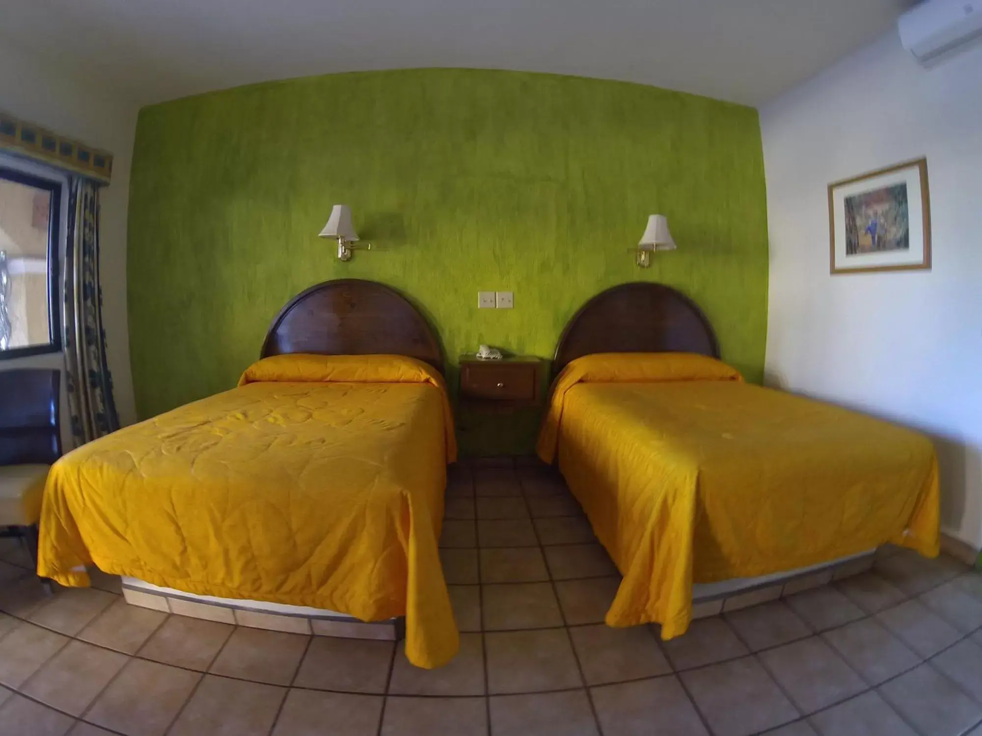 Photo of the whole room, Bed in Hacienda Suites Loreto