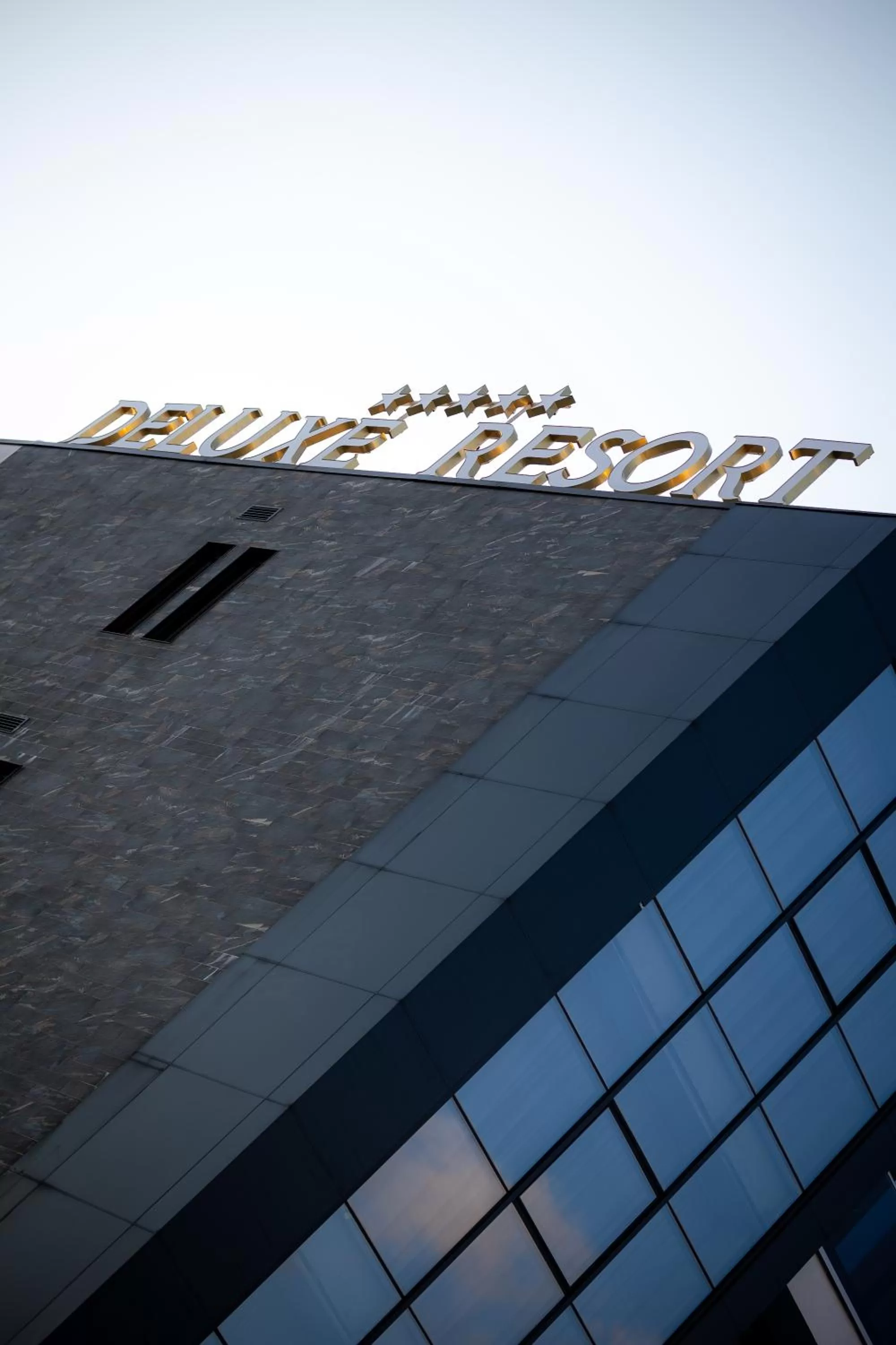 Property logo or sign in Deluxe Resort and SPA