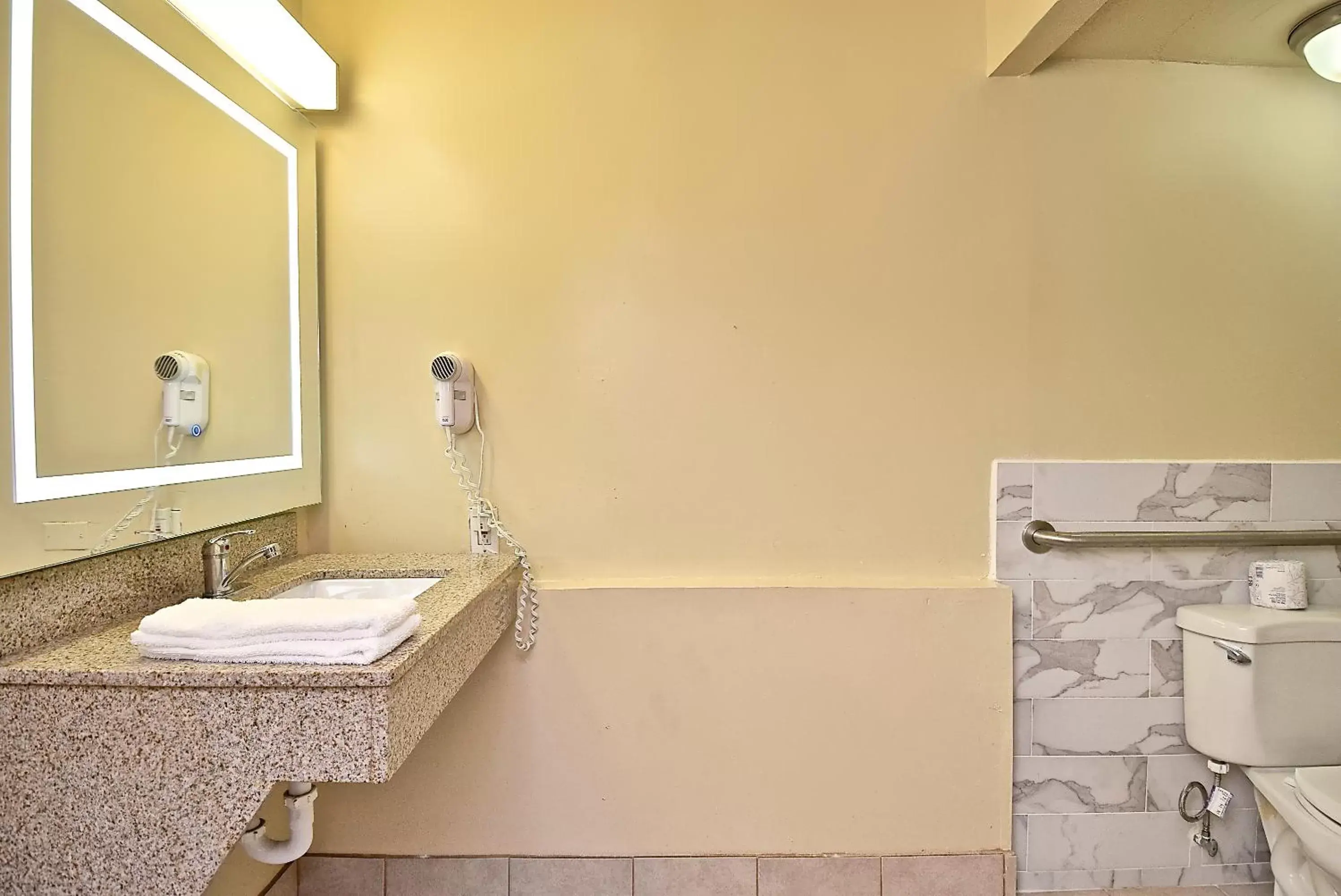 Bathroom in SureStay Hotel by Best Western Sarasota Lido Beach