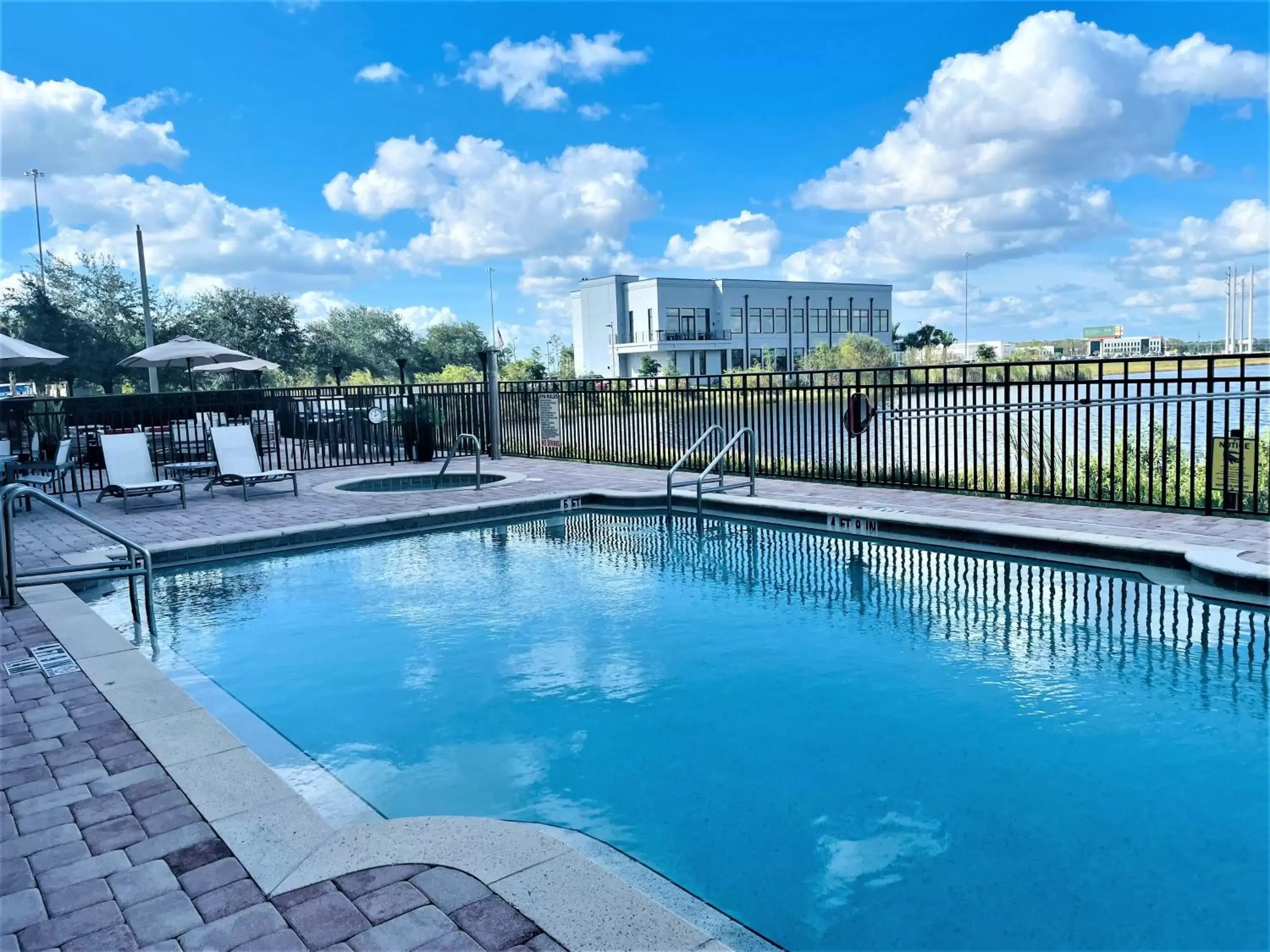 Swimming Pool in Crowne Plaza Fort Myers Gulf Coast, an IHG Hotel