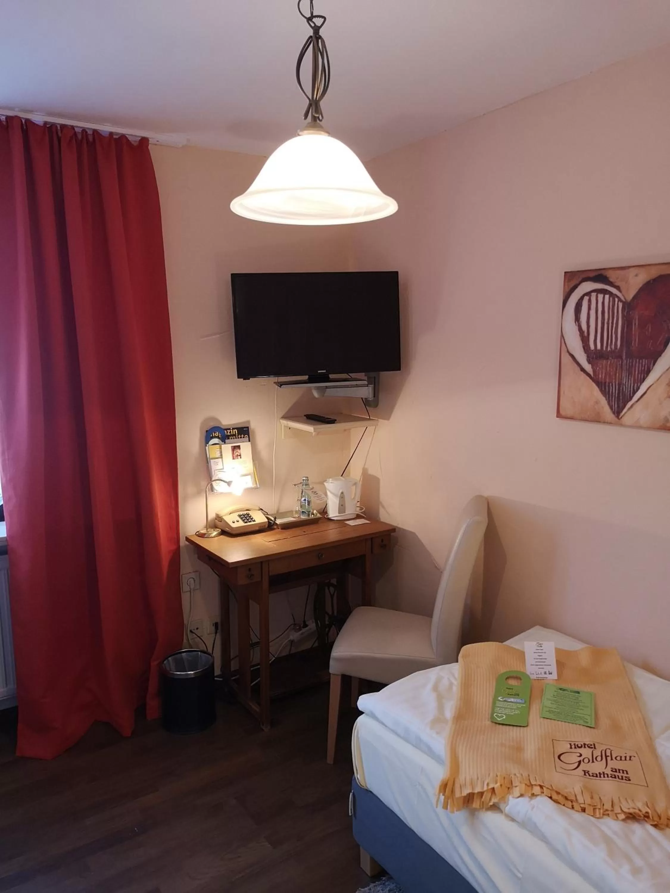 Photo of the whole room, Bed in Hotel Goldflair am Rathaus