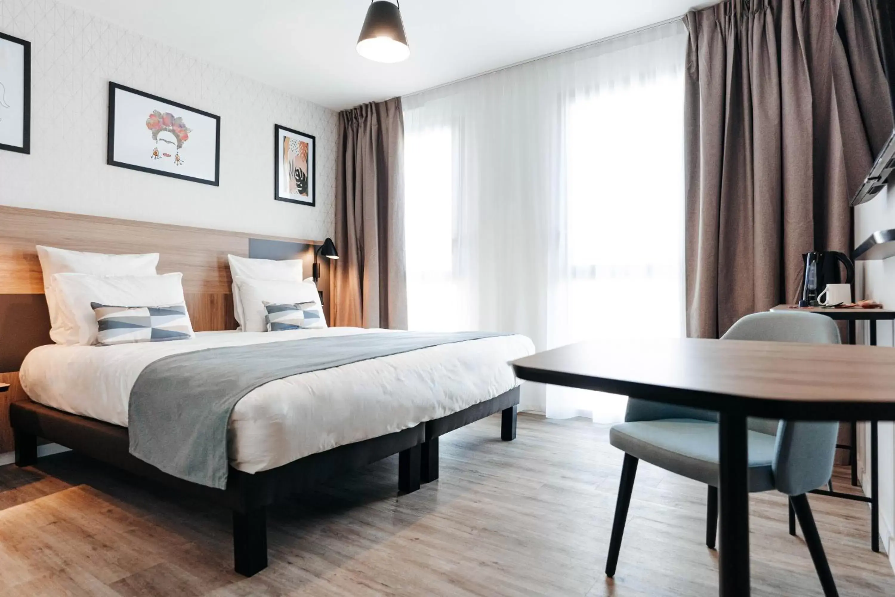 Photo of the whole room, Bed in Appart'City Collection Saint Germain en Laye Photo of the whole room, Bed in Appart'City Collection Saint Germain en Laye