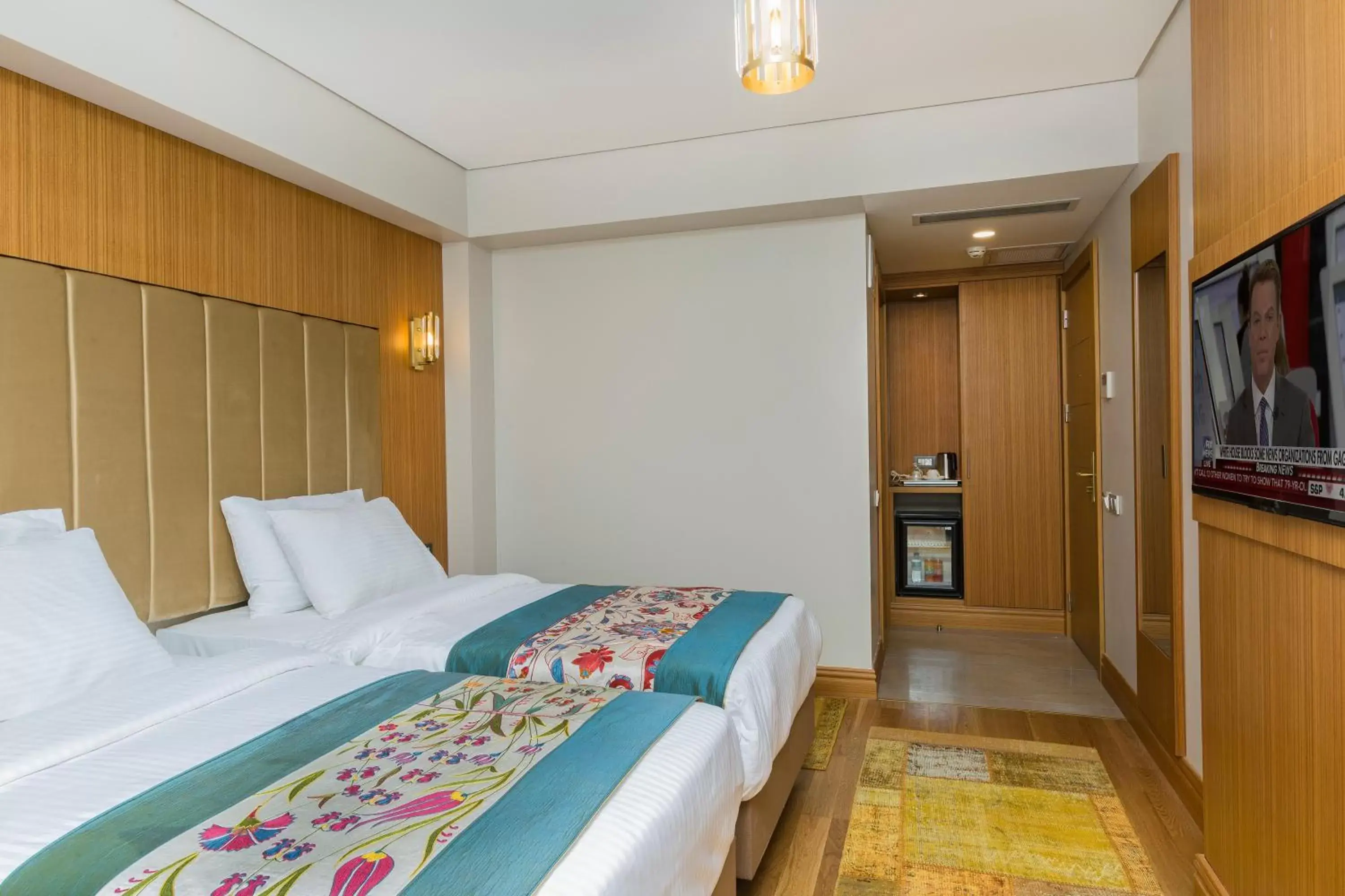 Bed in Obelisk Hotel & Suites