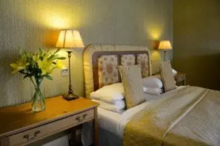 Bed in Mabie House Hotel