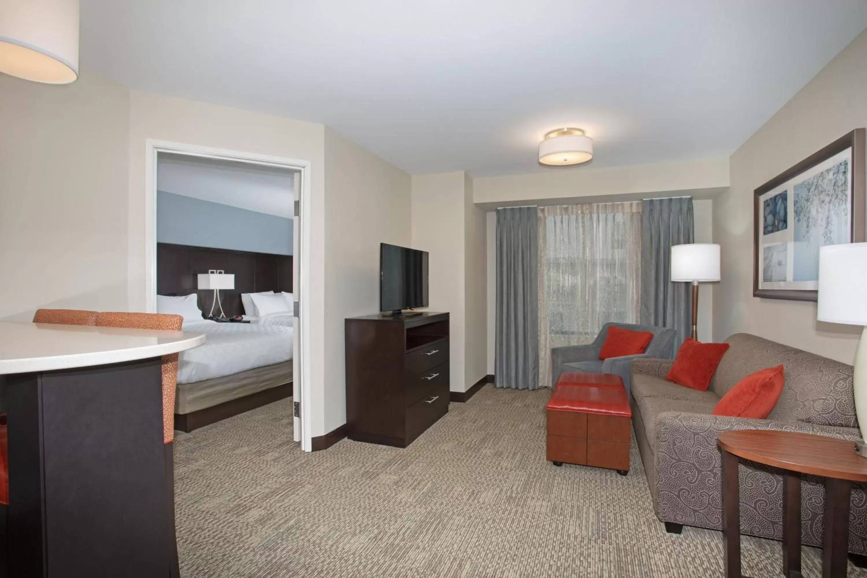 Bedroom, Seating Area in Staybridge Suites Denver South - Highlands Ranch, an IHG Hotel