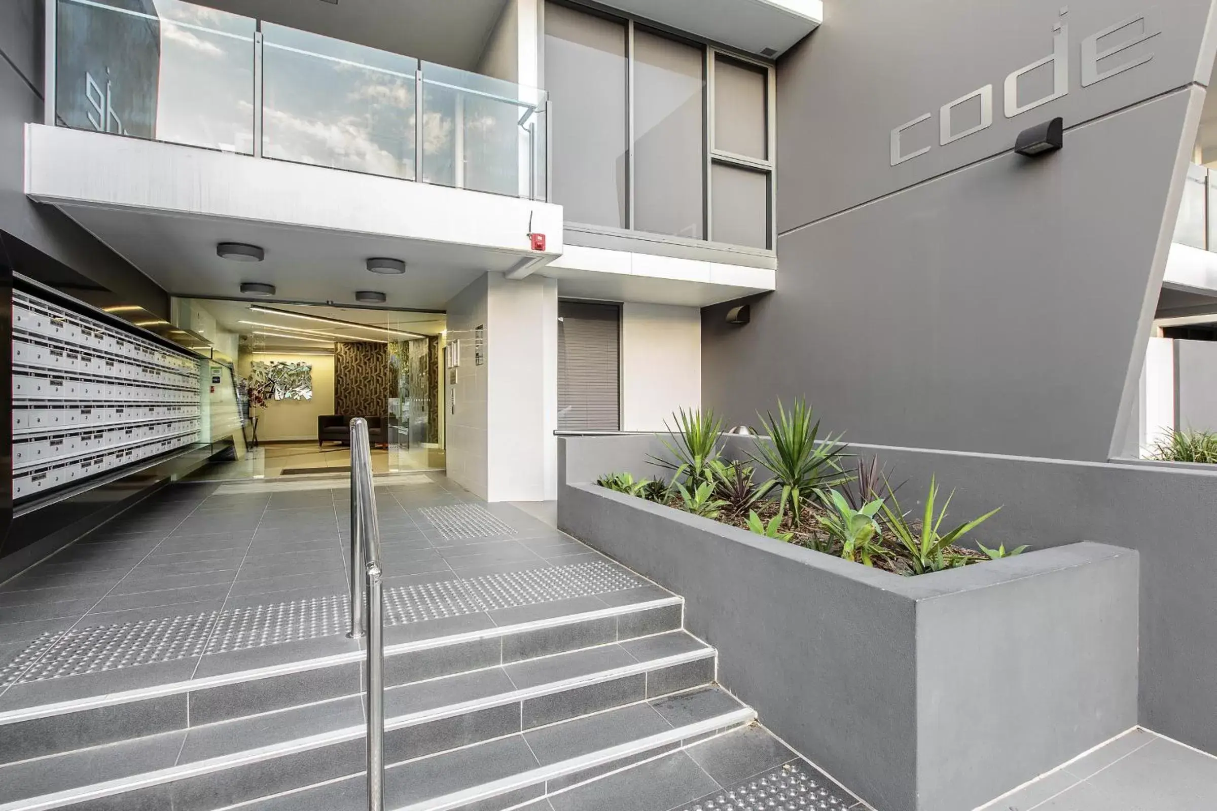 Facade/entrance in Code Apartments Facade/entrance in Code Apartments