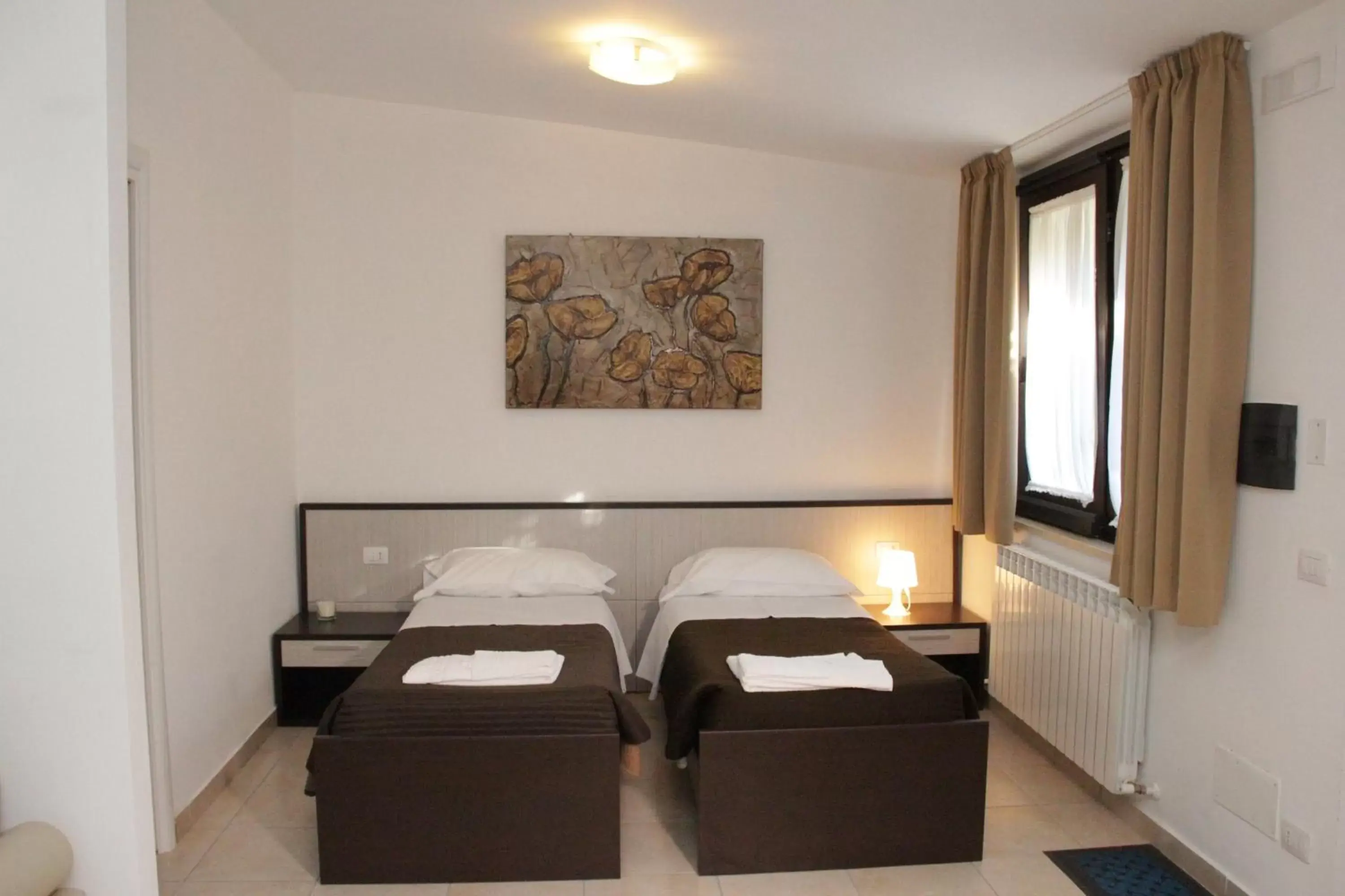 Bed, Seating Area in San Michele Apartments&Rooms