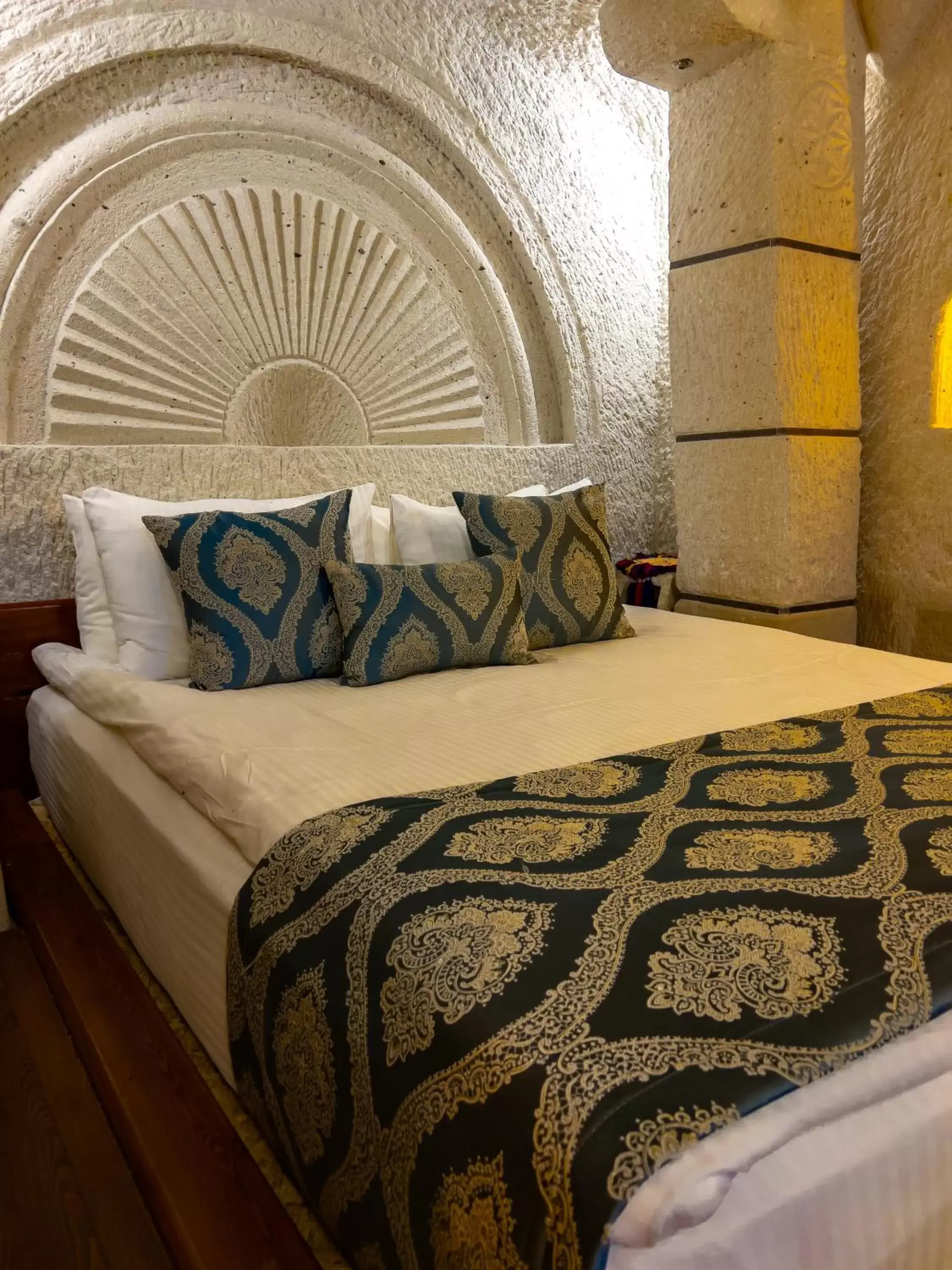 Bed in Local Cave House Hotel