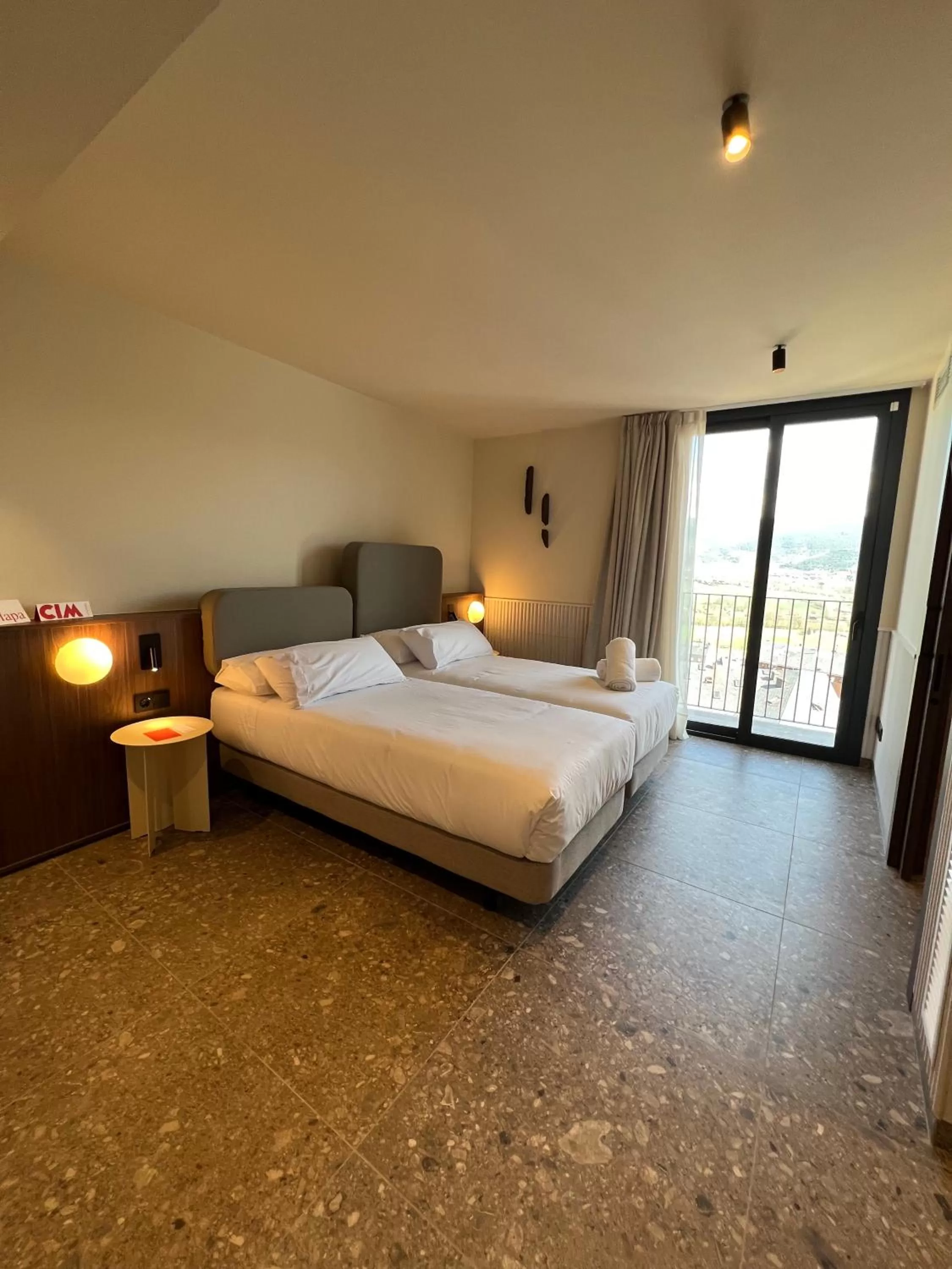 Bed in CIM HOTEL BOUTIQUE