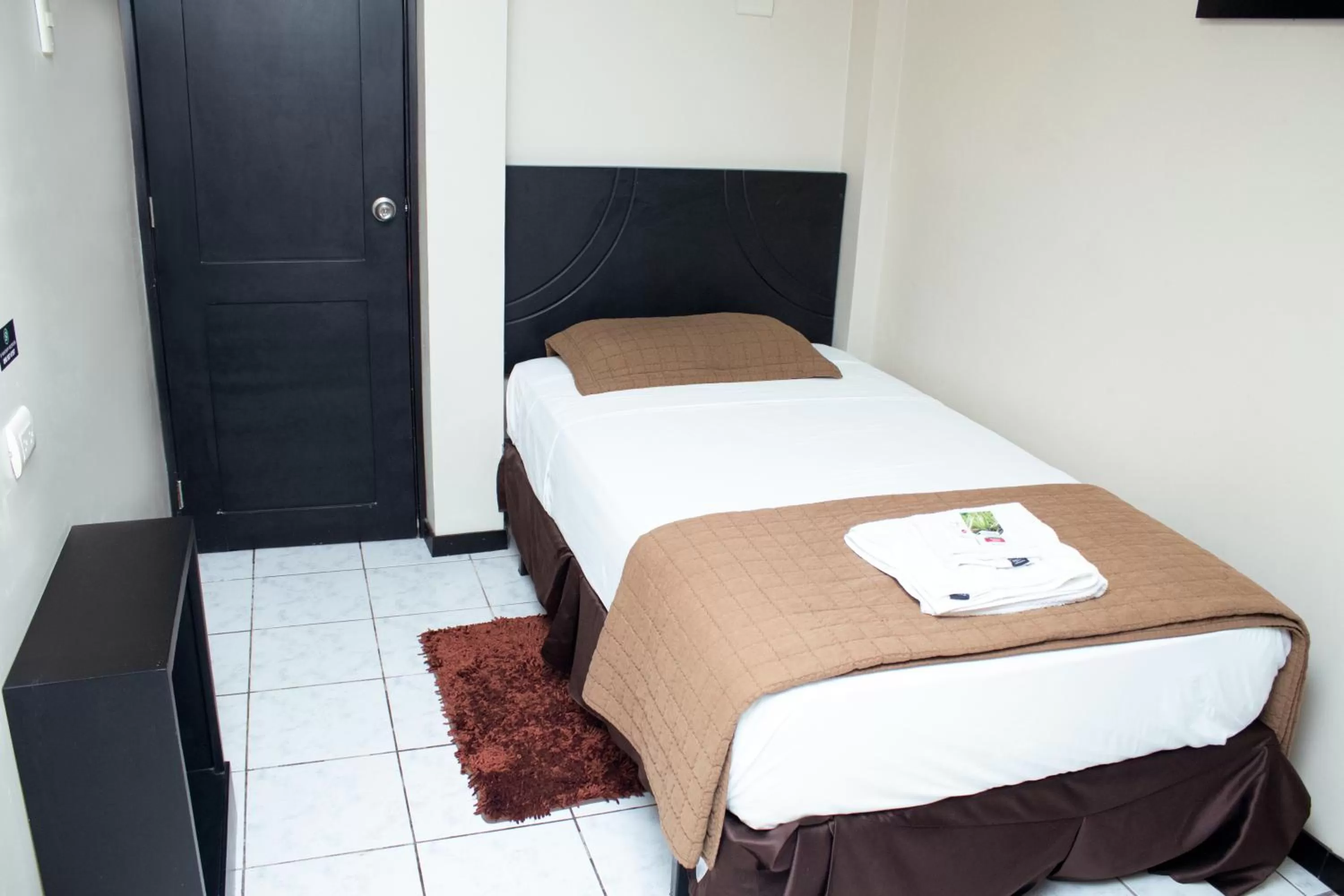 Bed in Paris Suite Hotel