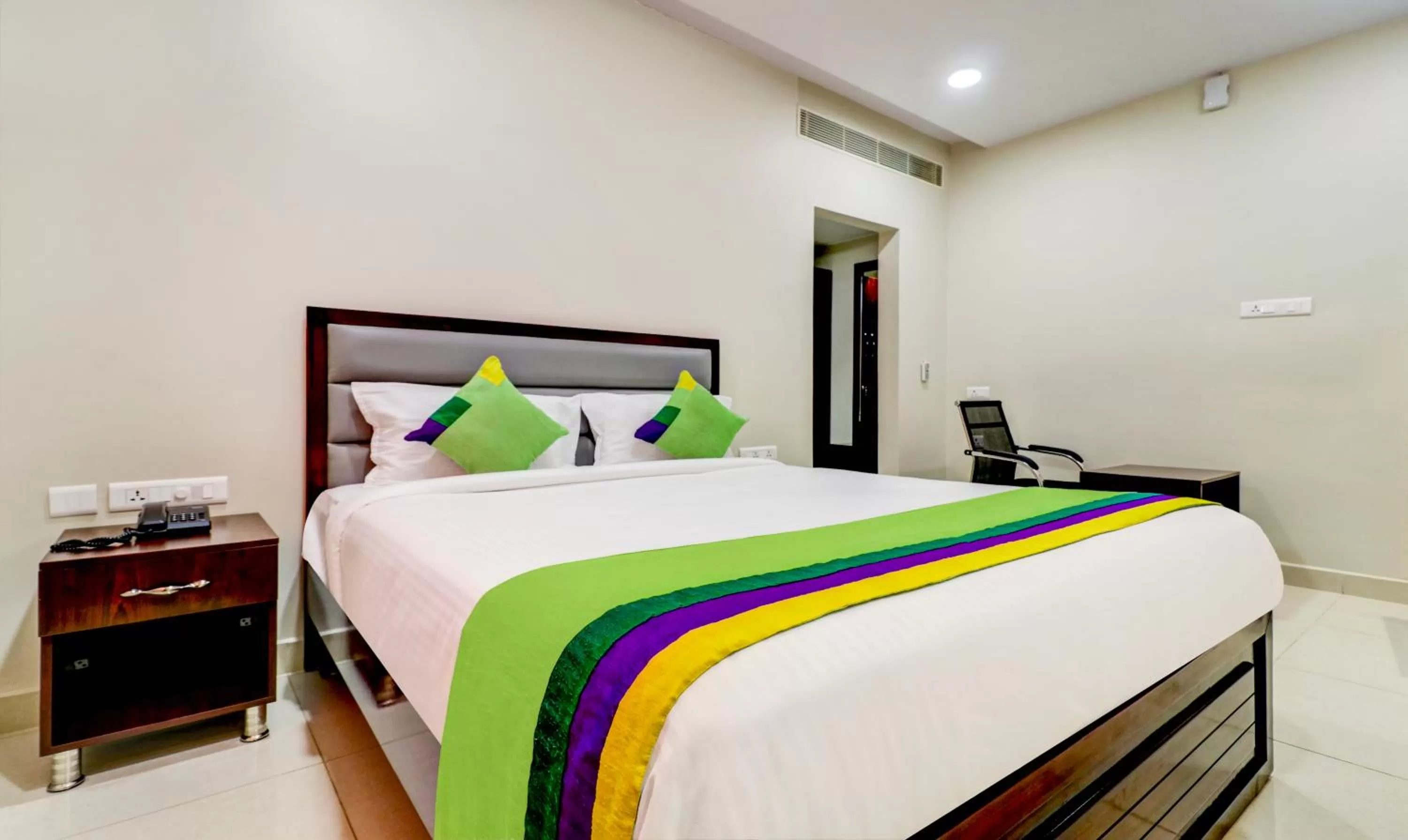 Bedroom, Bed in Treebo Grand Milan