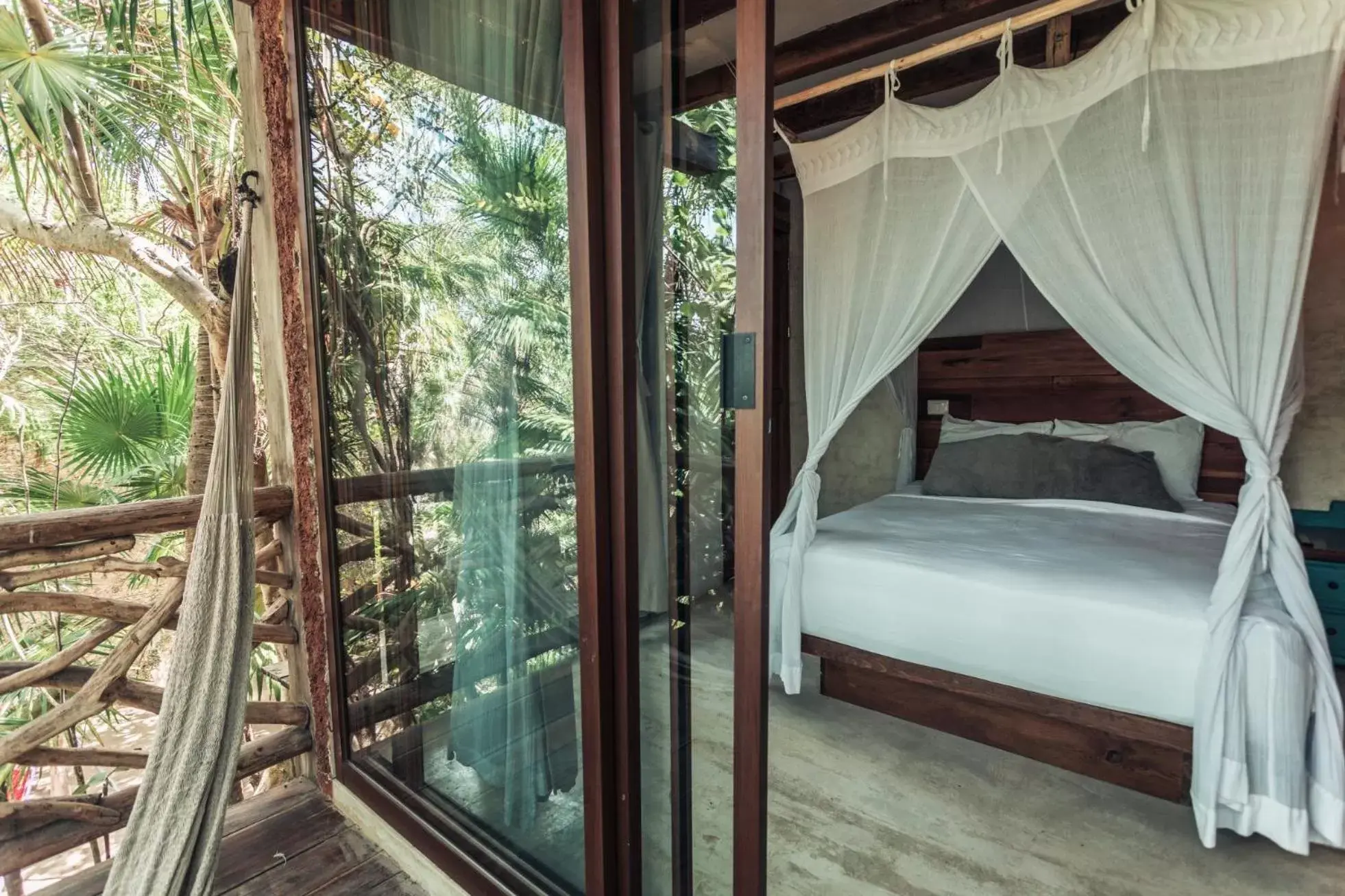 Bed in Hidden Treehouse Tulum Eco-Hotel