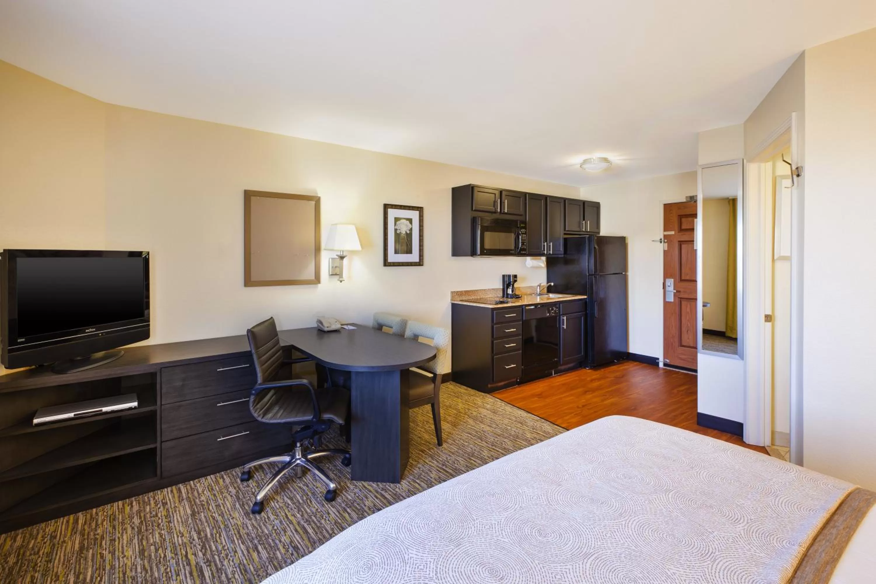Photo of the whole room, Bed in Candlewood Suites Indianapolis Airport by IHG