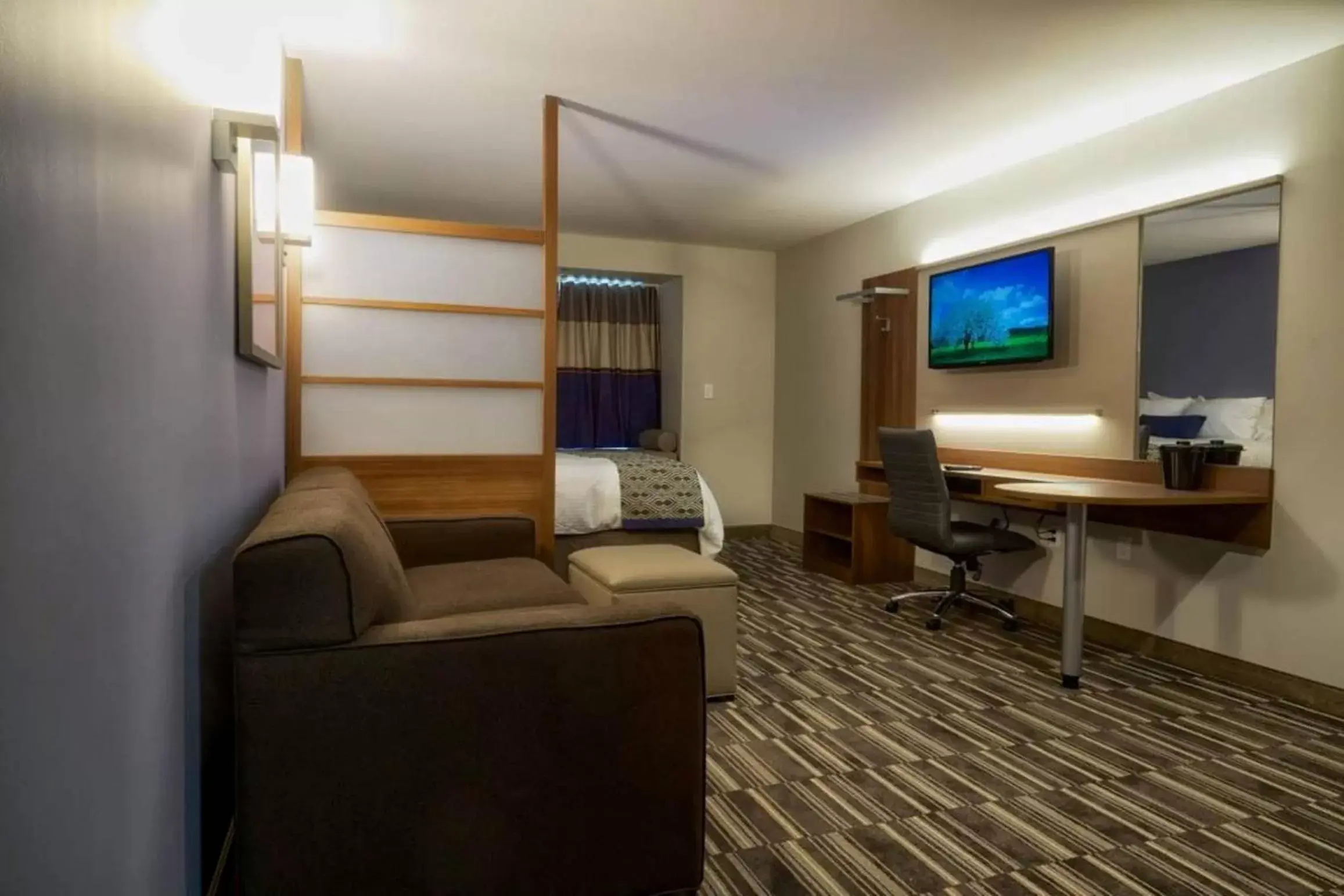 TV and multimedia, Seating Area in Microtel Inn & Suites Sault Ste. Marie