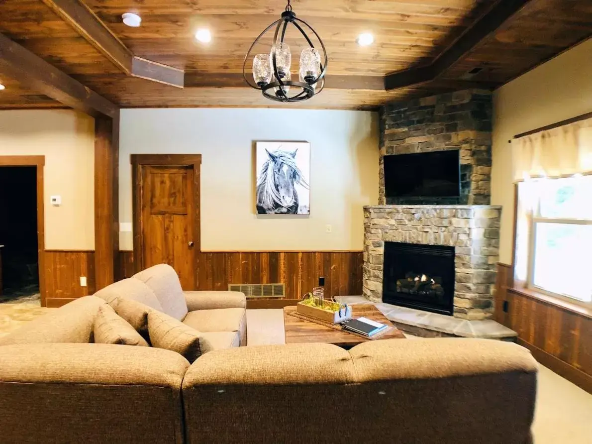 Bed in Sojourner's Lodge & Log Cabin Suites