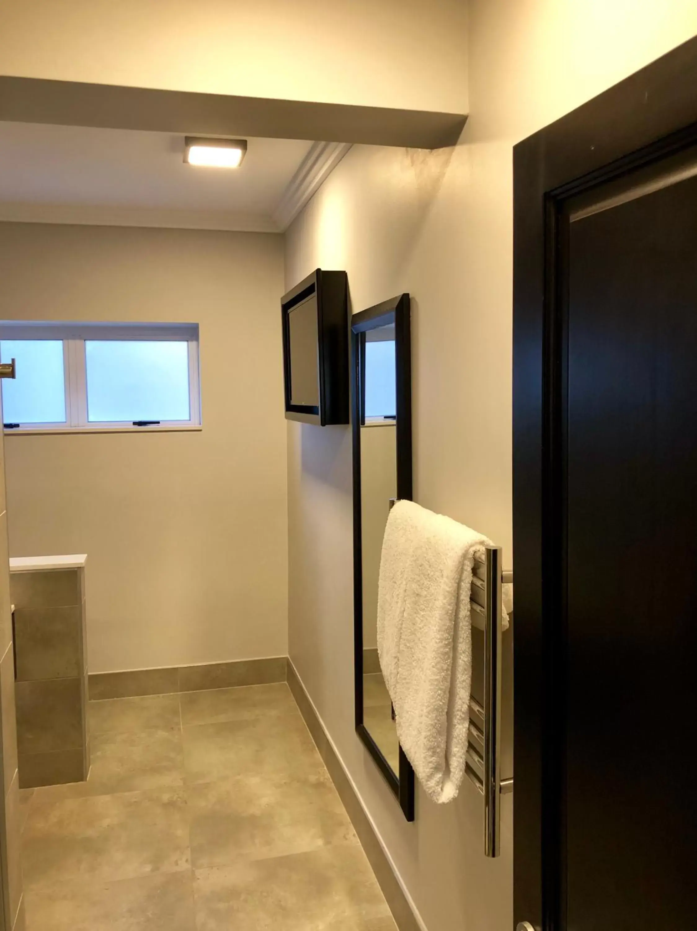 Bathroom in Belaire Suites Hotel