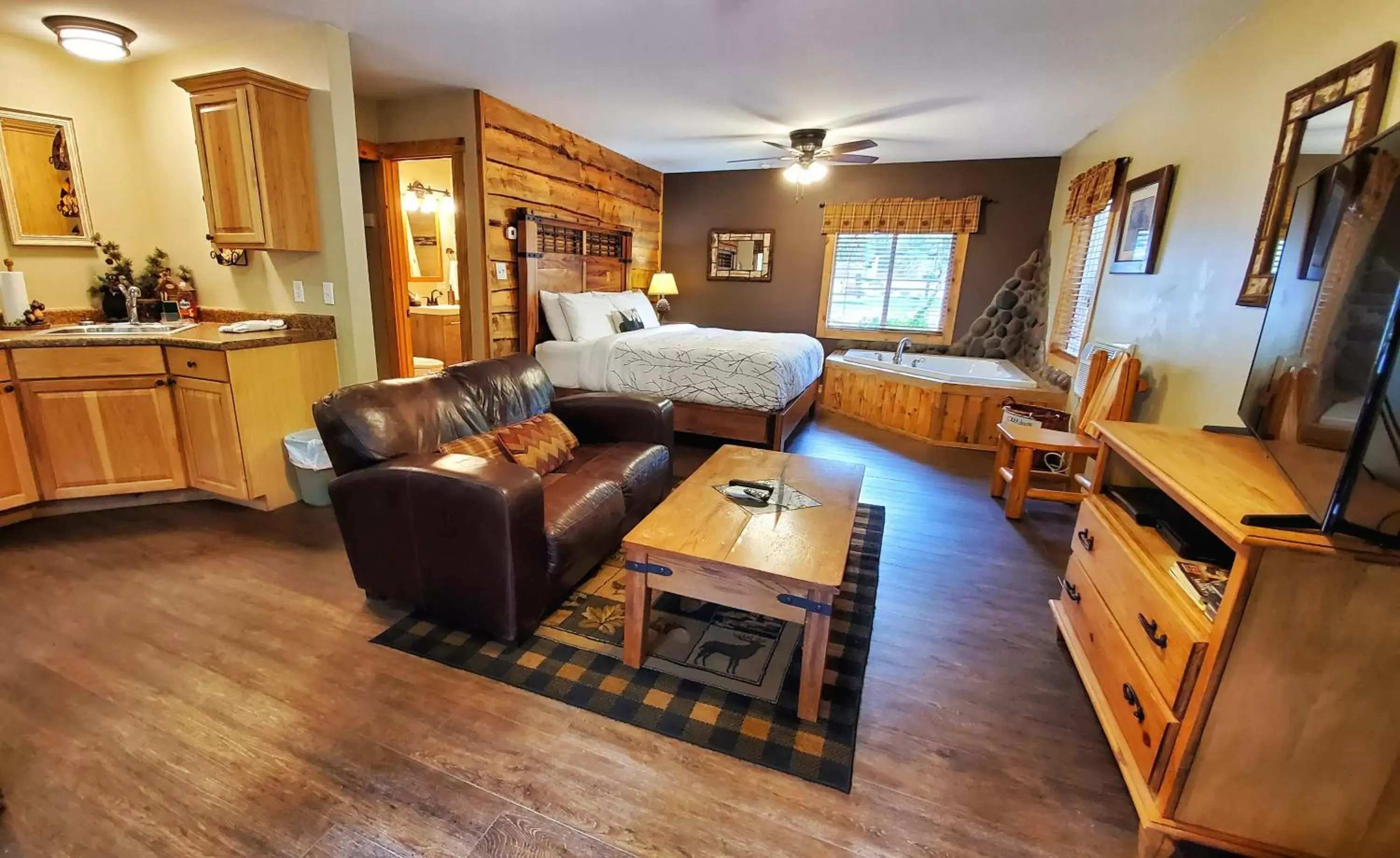 Bed, Seating Area in The Inn on Fall River & Fall River Cabins
