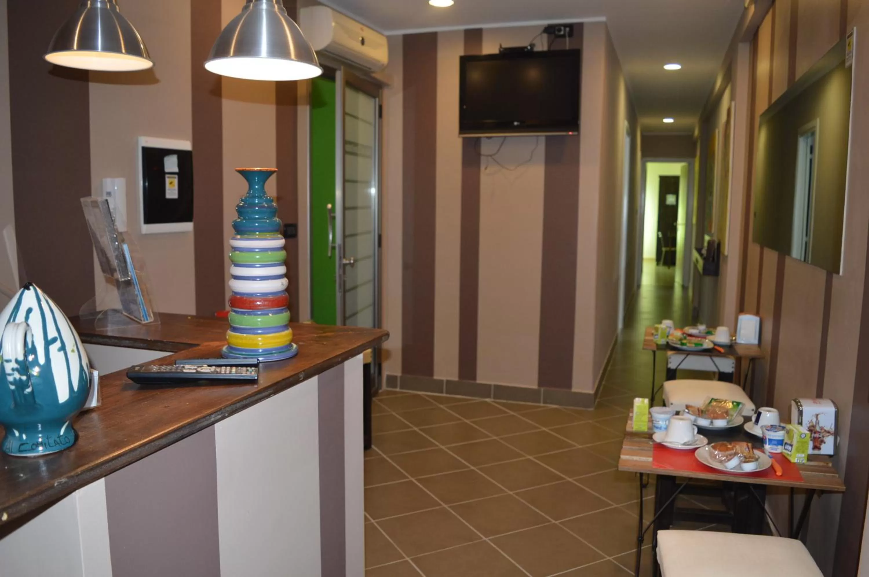 Communal lounge/ TV room in B&B Al Comitato