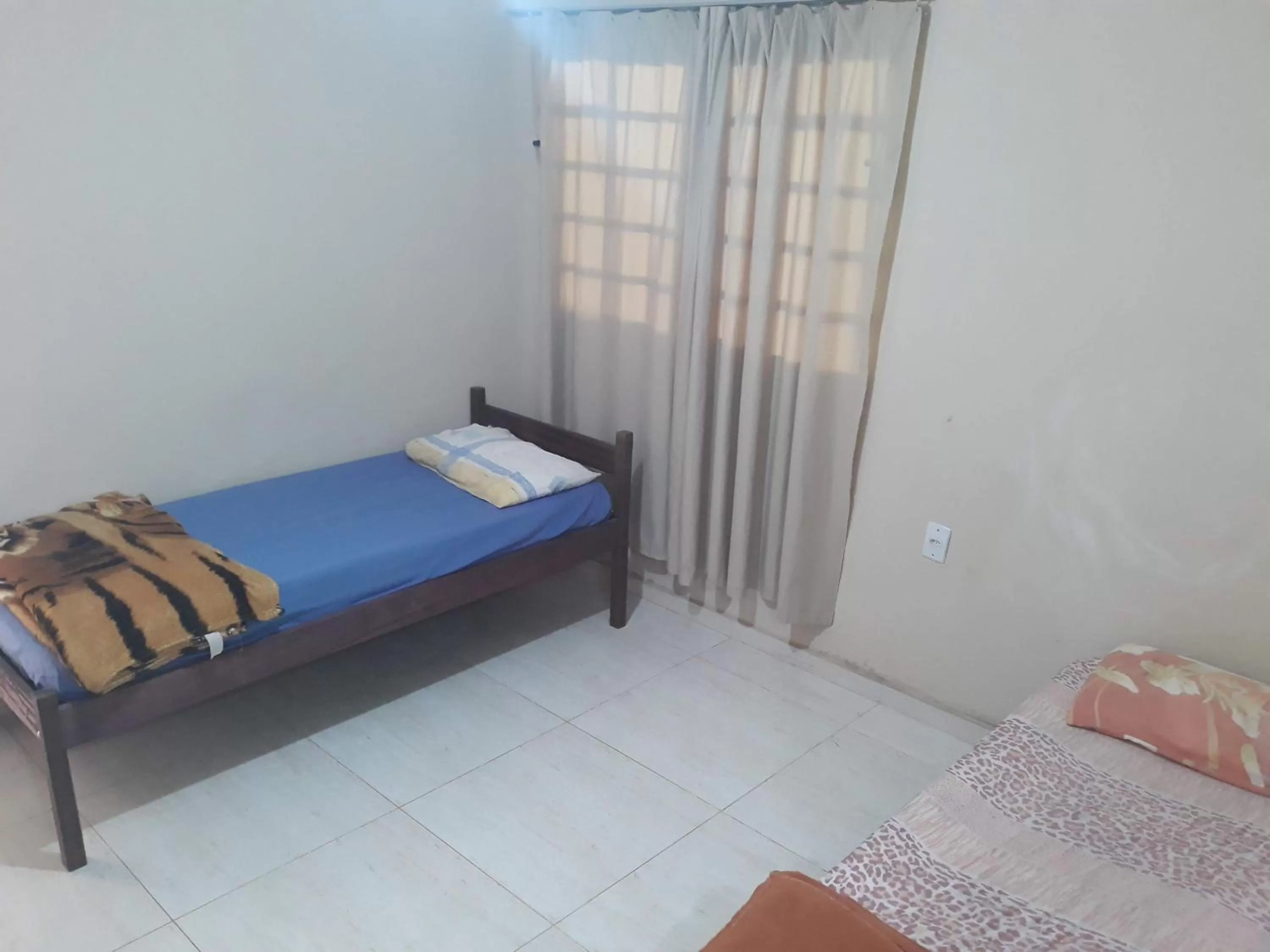 Bed in Pousada do Ribeirão