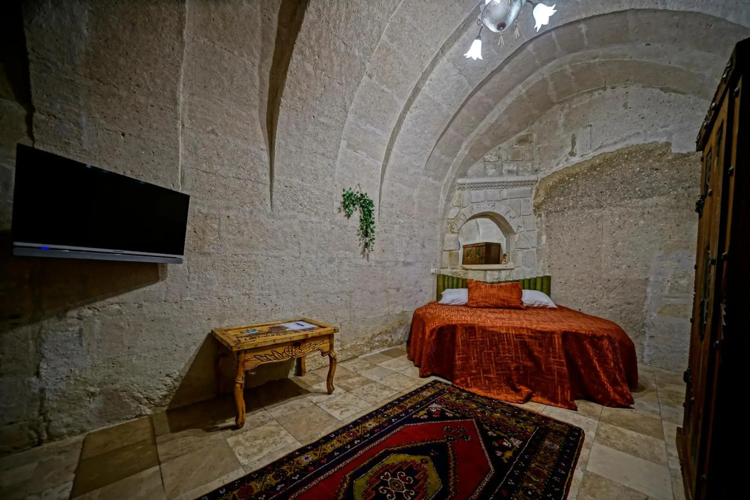 Bed in Holiday Cave Hotel