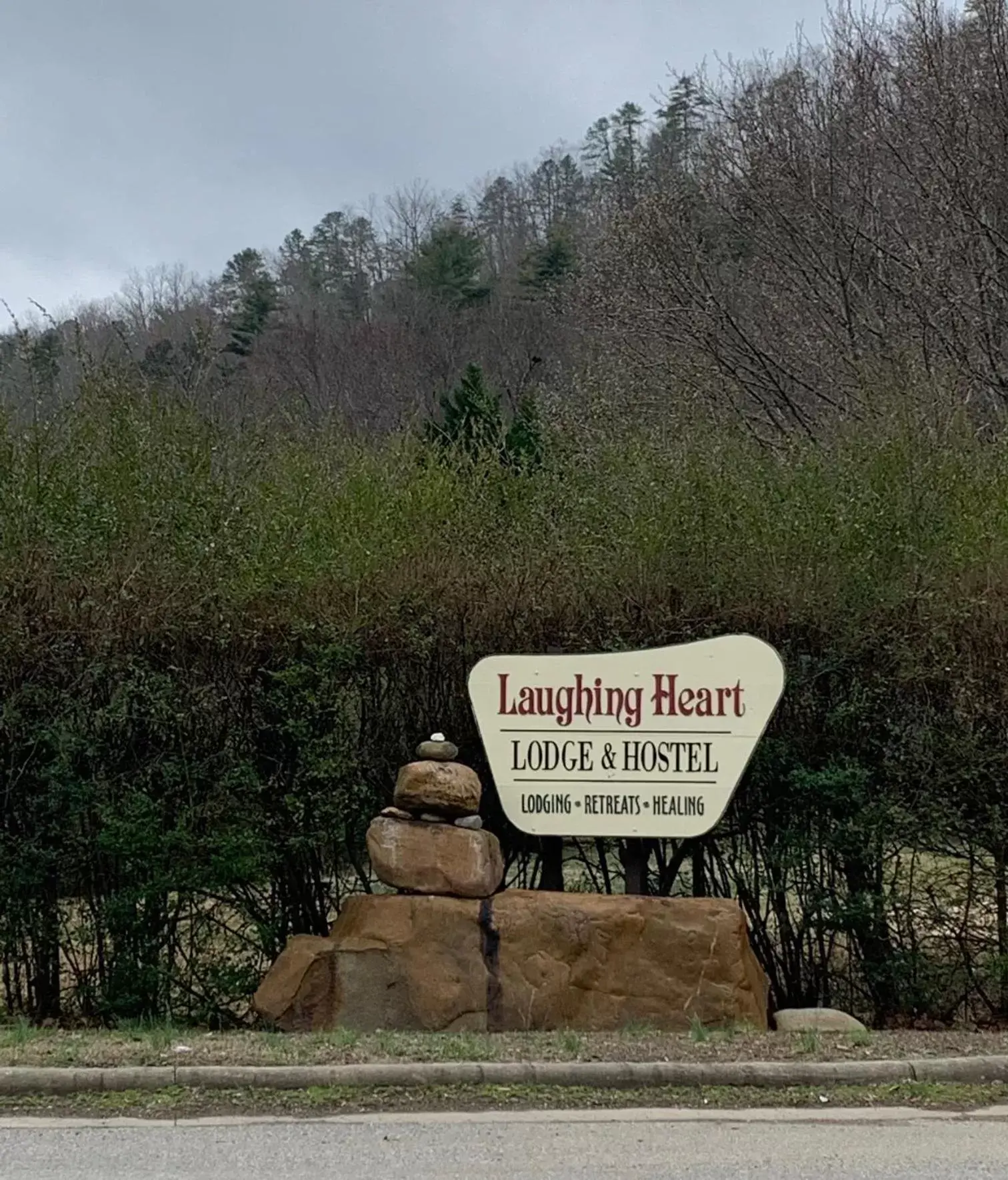 Property logo or sign in Laughing Heart Lodge