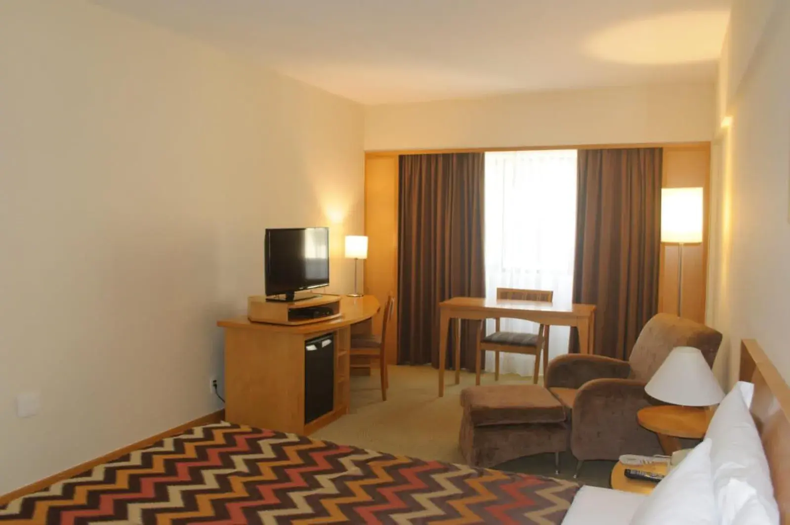 Photo of the whole room, TV/Entertainment Center in Sol Alphaville Hotel & Residence