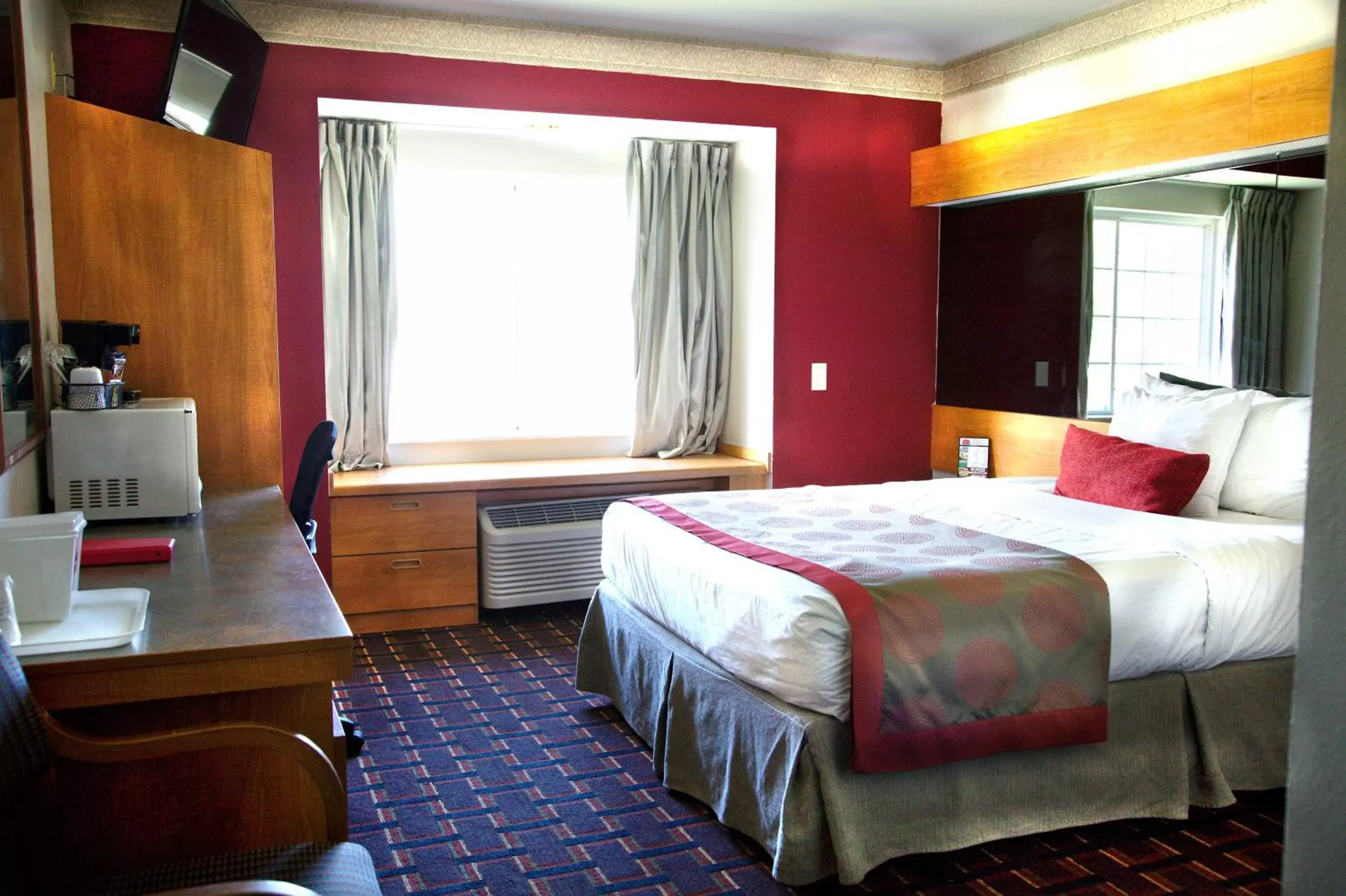 Bedroom in Ramada Limited and Suites Bloomington