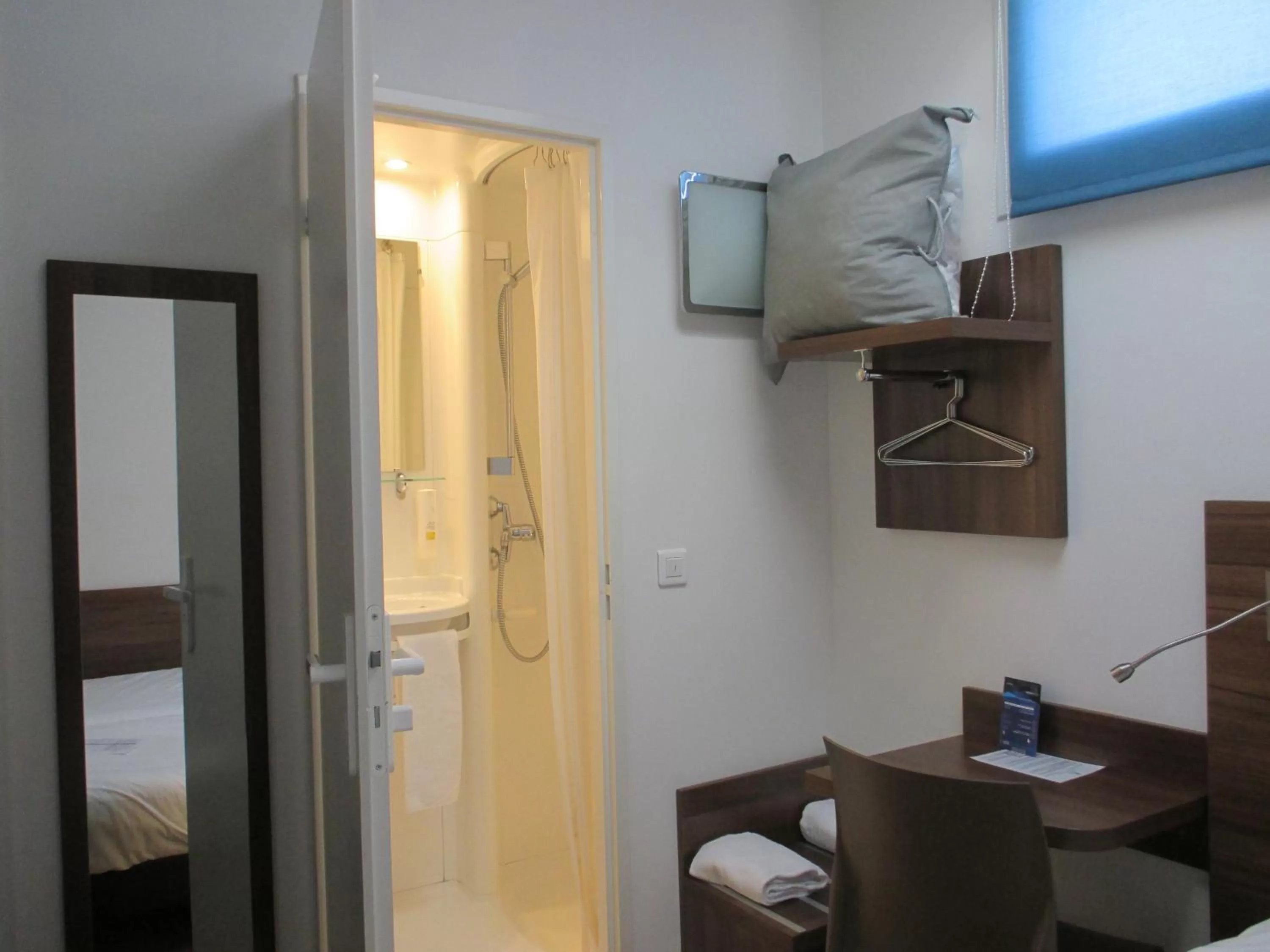 Bedroom in Hôtel le Pastel