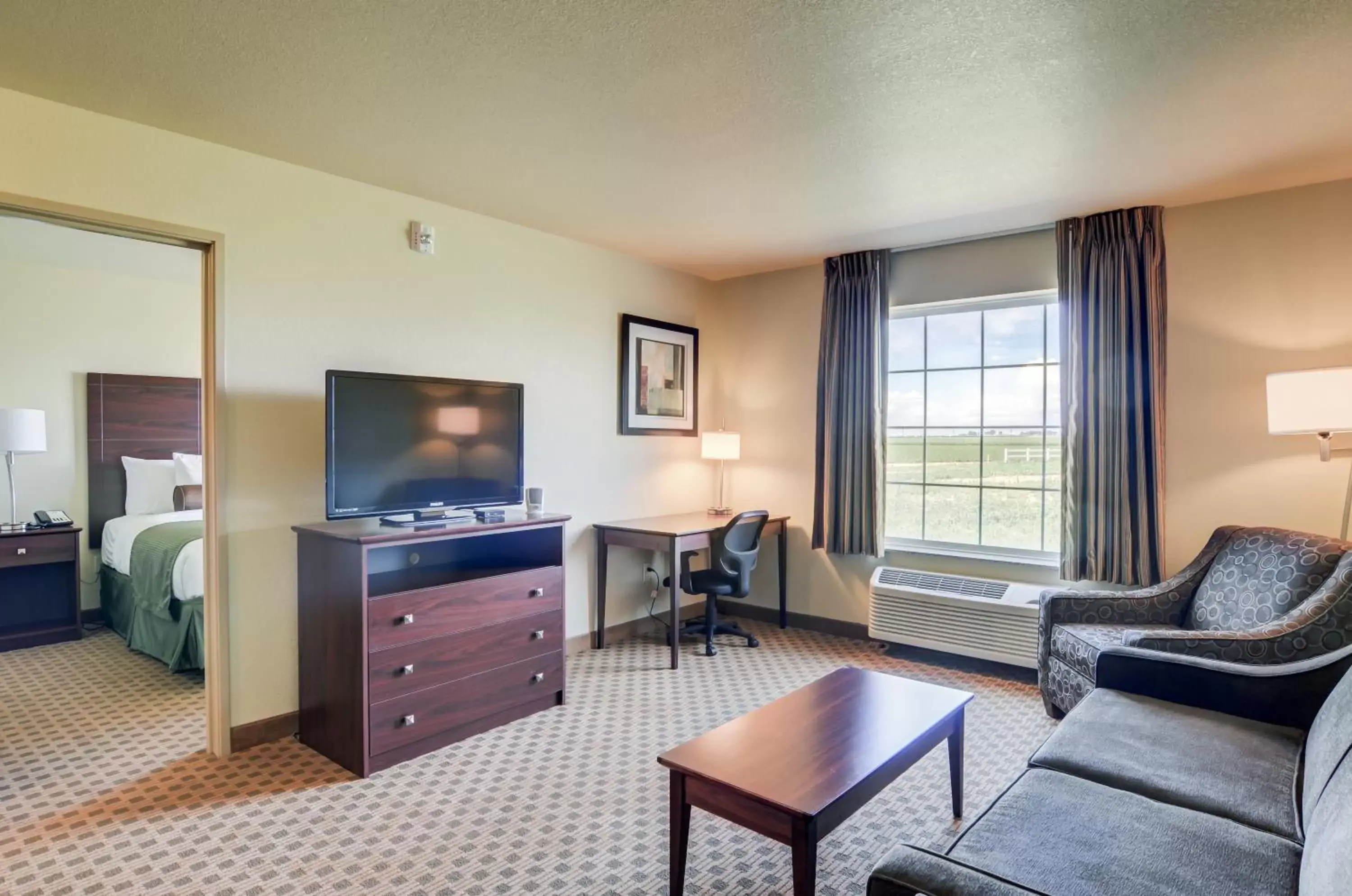 Bed, Seating Area in Cobblestone Inn & Suites - Ord