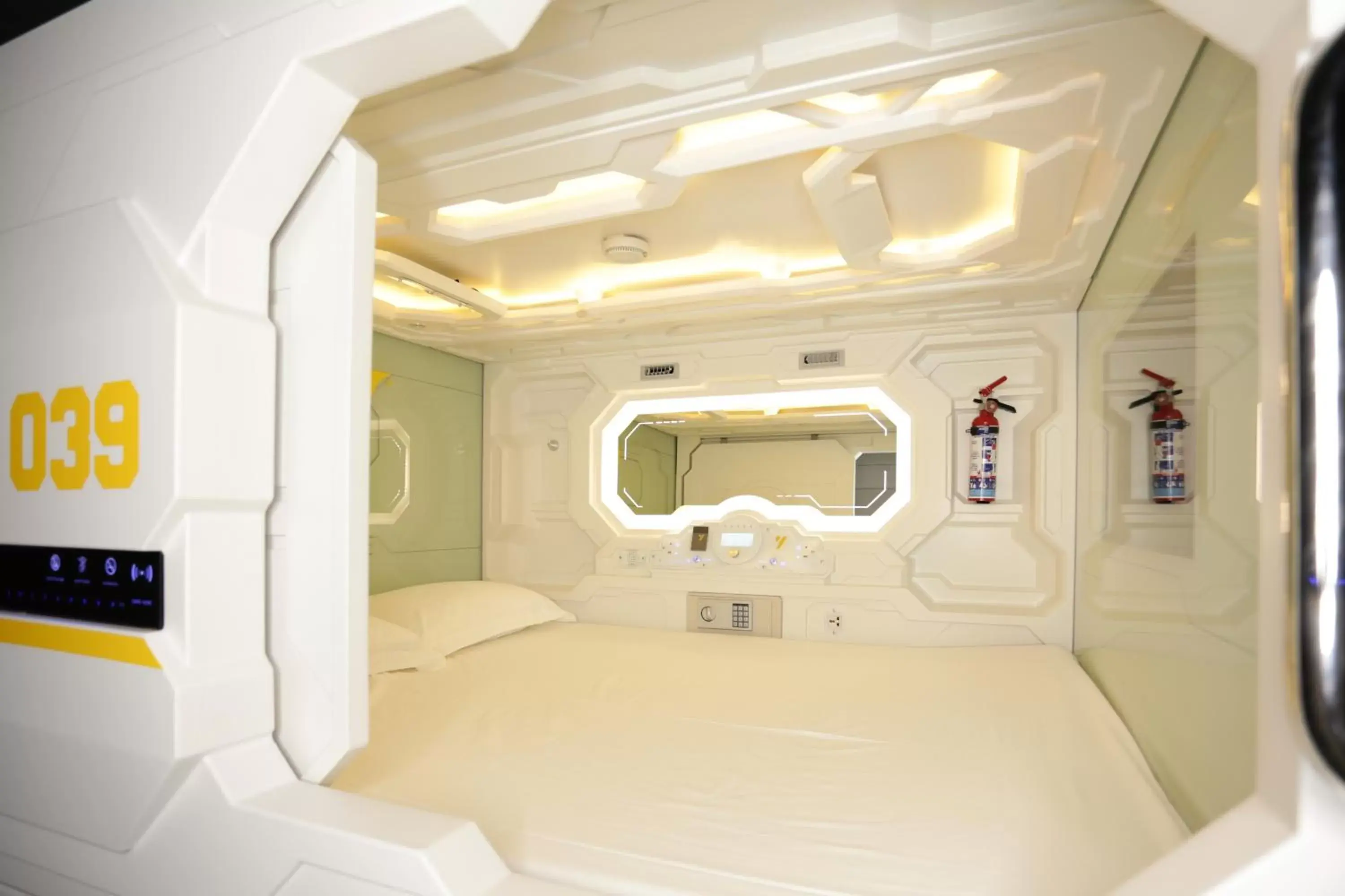 Photo of the whole room, Bed in The Yellow Capsule Experience