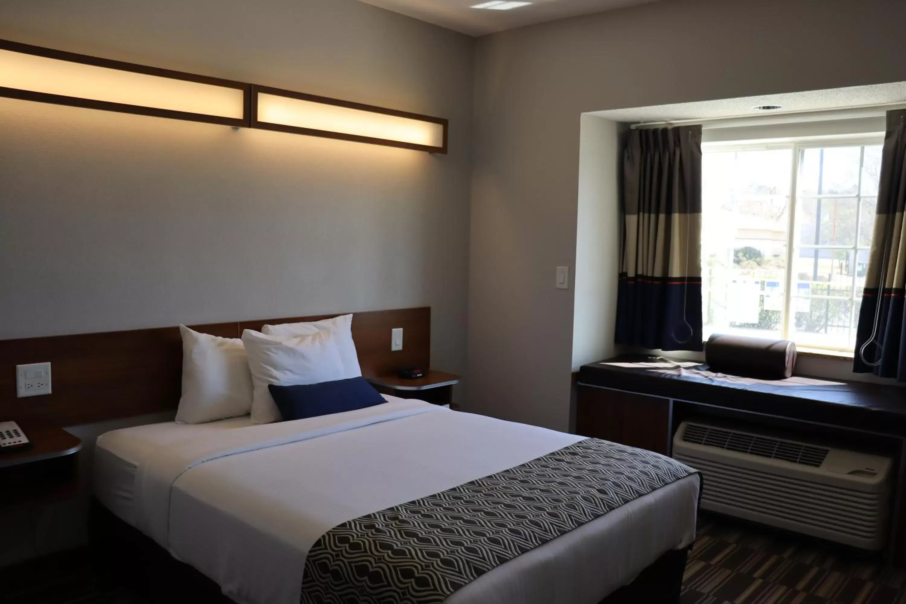 Bed in Microtel Inn & Suites by Wyndham Columbus Near Fort Moore