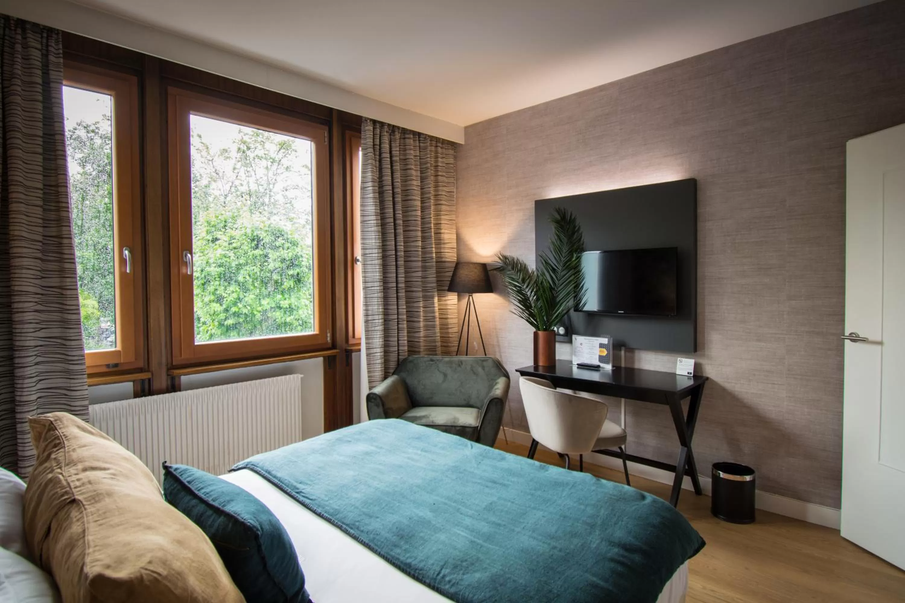 Communal lounge/ TV room, Bed in Hôtel Restaurant Vaillant proche Europapark Rulantica