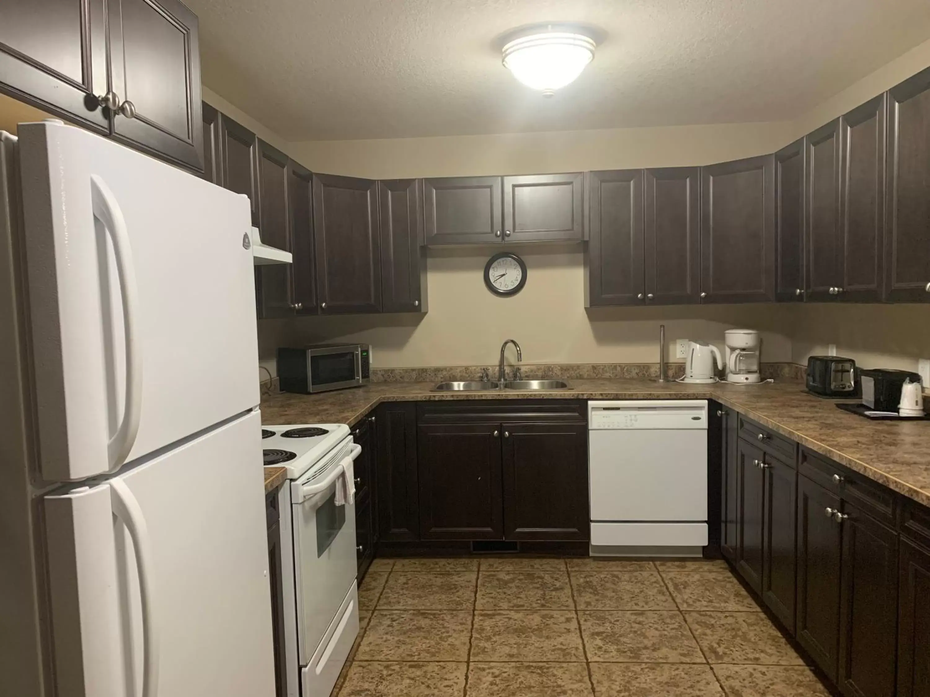 Kitchen or kitchenette, Kitchen/Kitchenette in Super 8 by Wyndham Fort McMurray