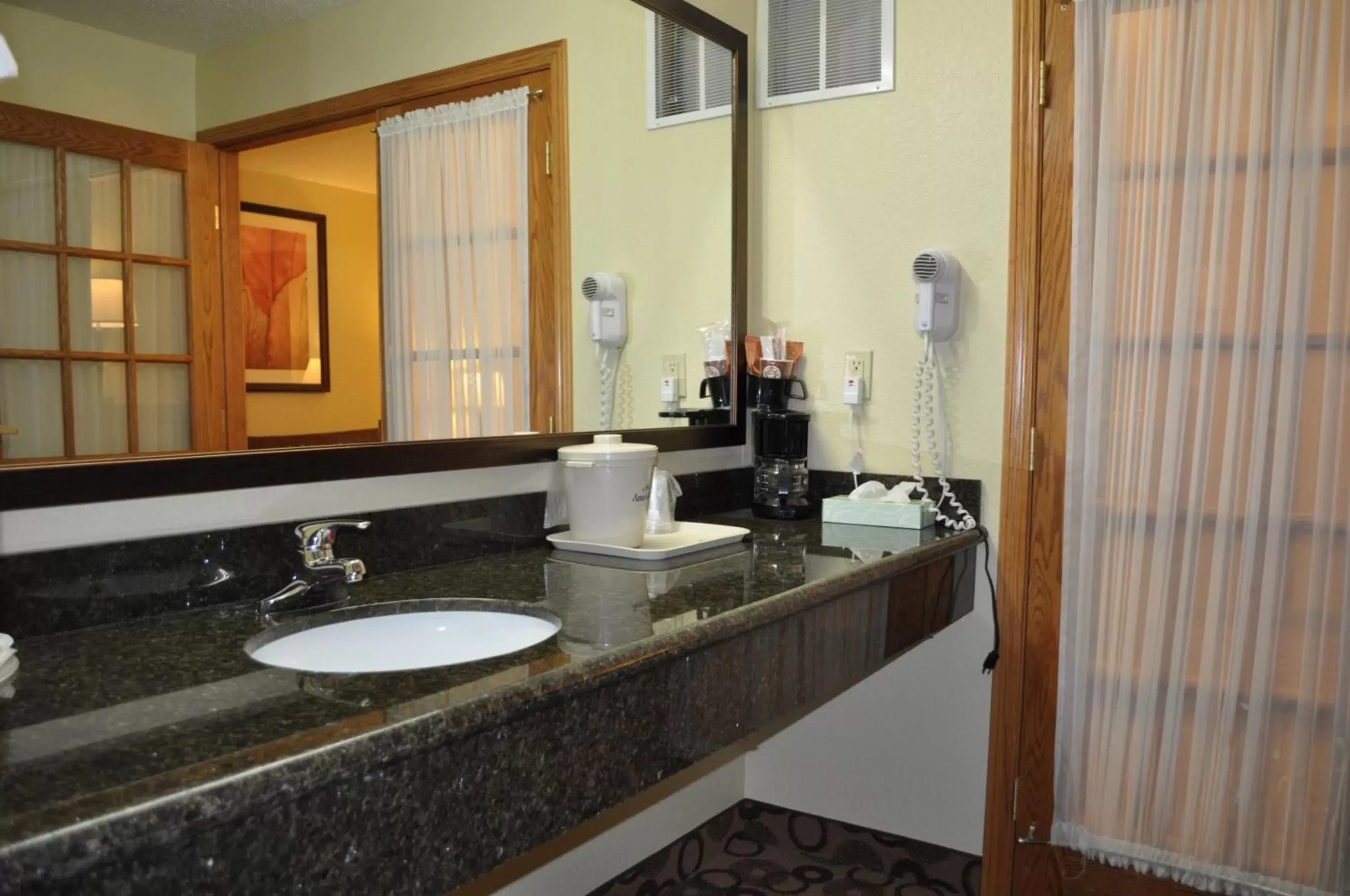 Bathroom in AmericInn by Wyndham Cedar Falls