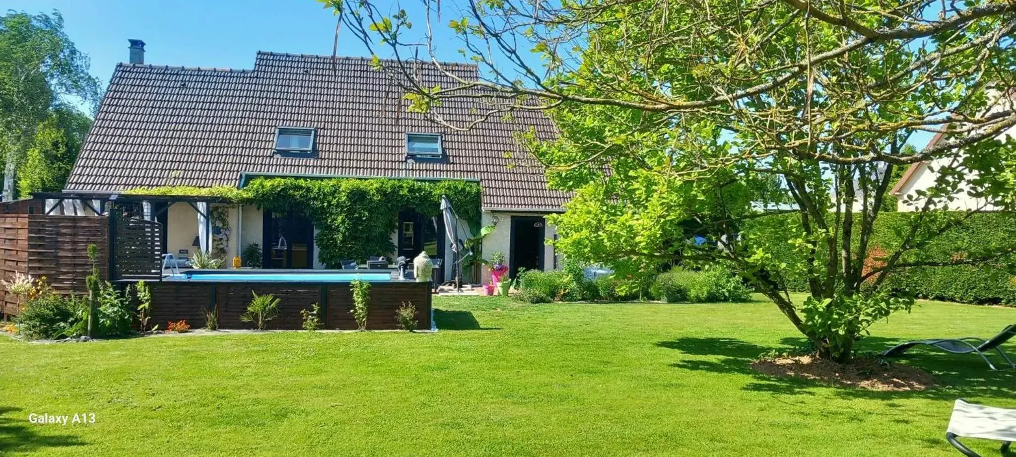 Garden view, Property Building in Les Epinettes chambres d'hôtes