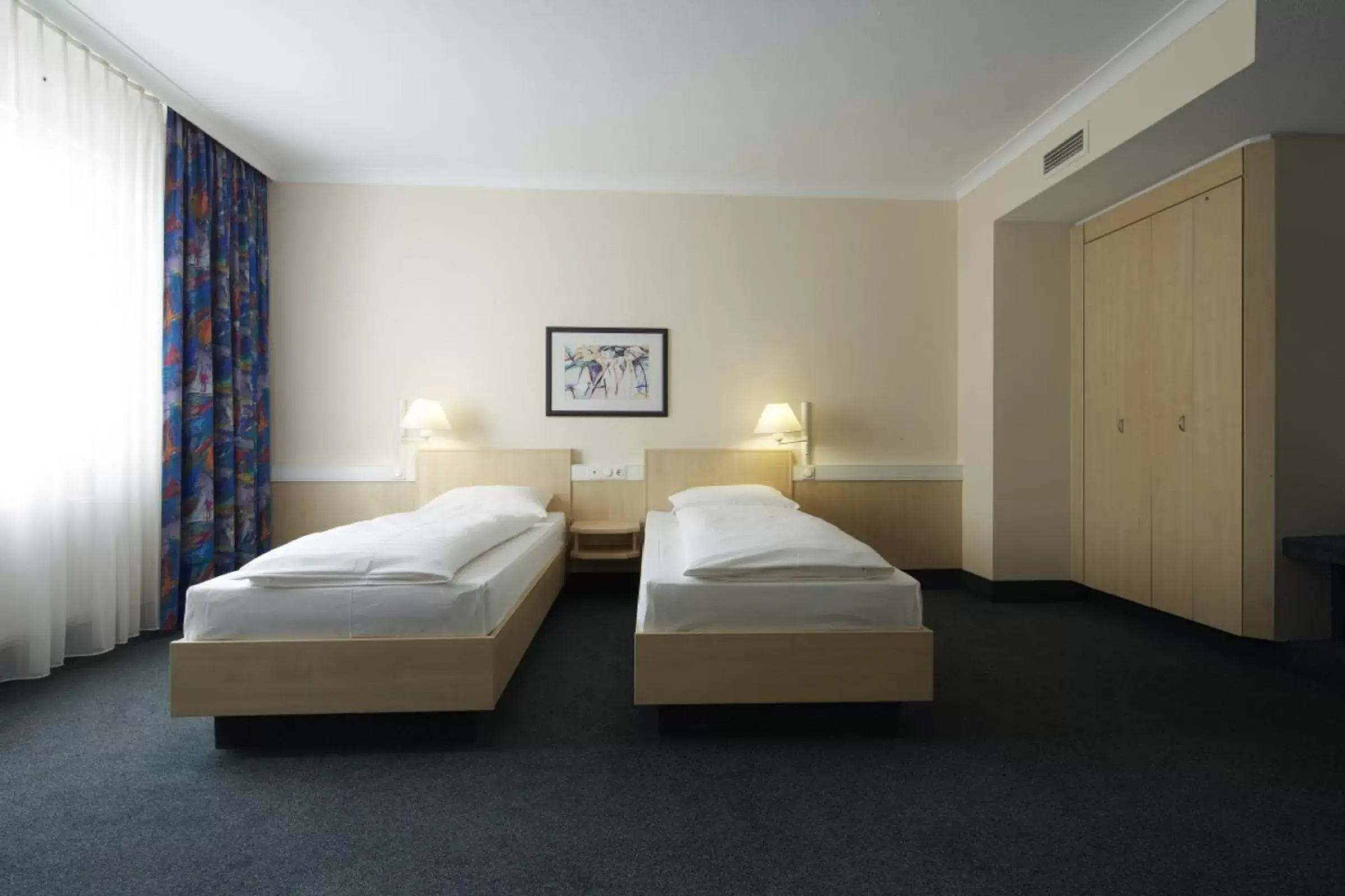 Photo of the whole room, Bed in IntercityHotel Kassel