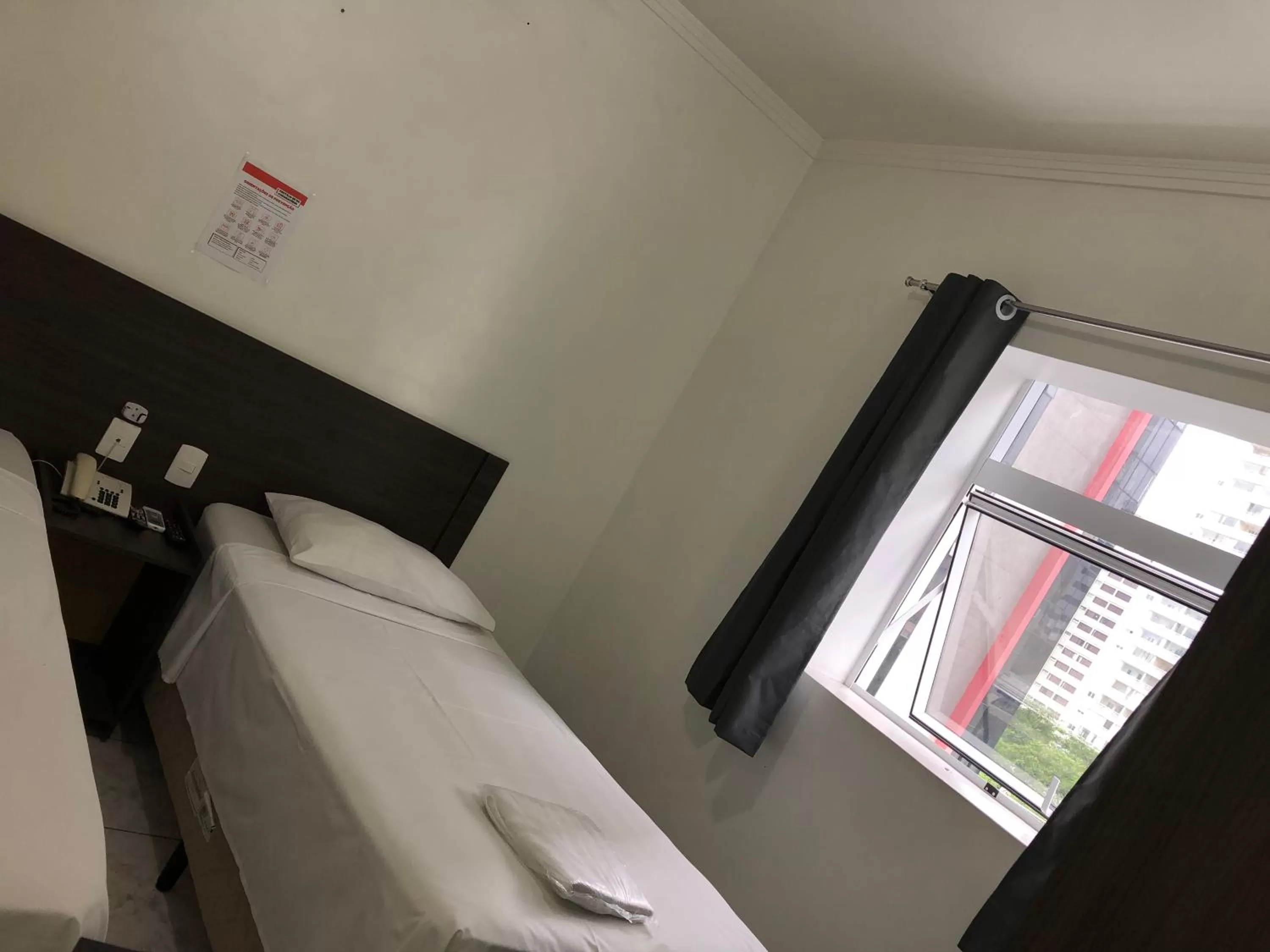 Bed in Center Plaza Hotel