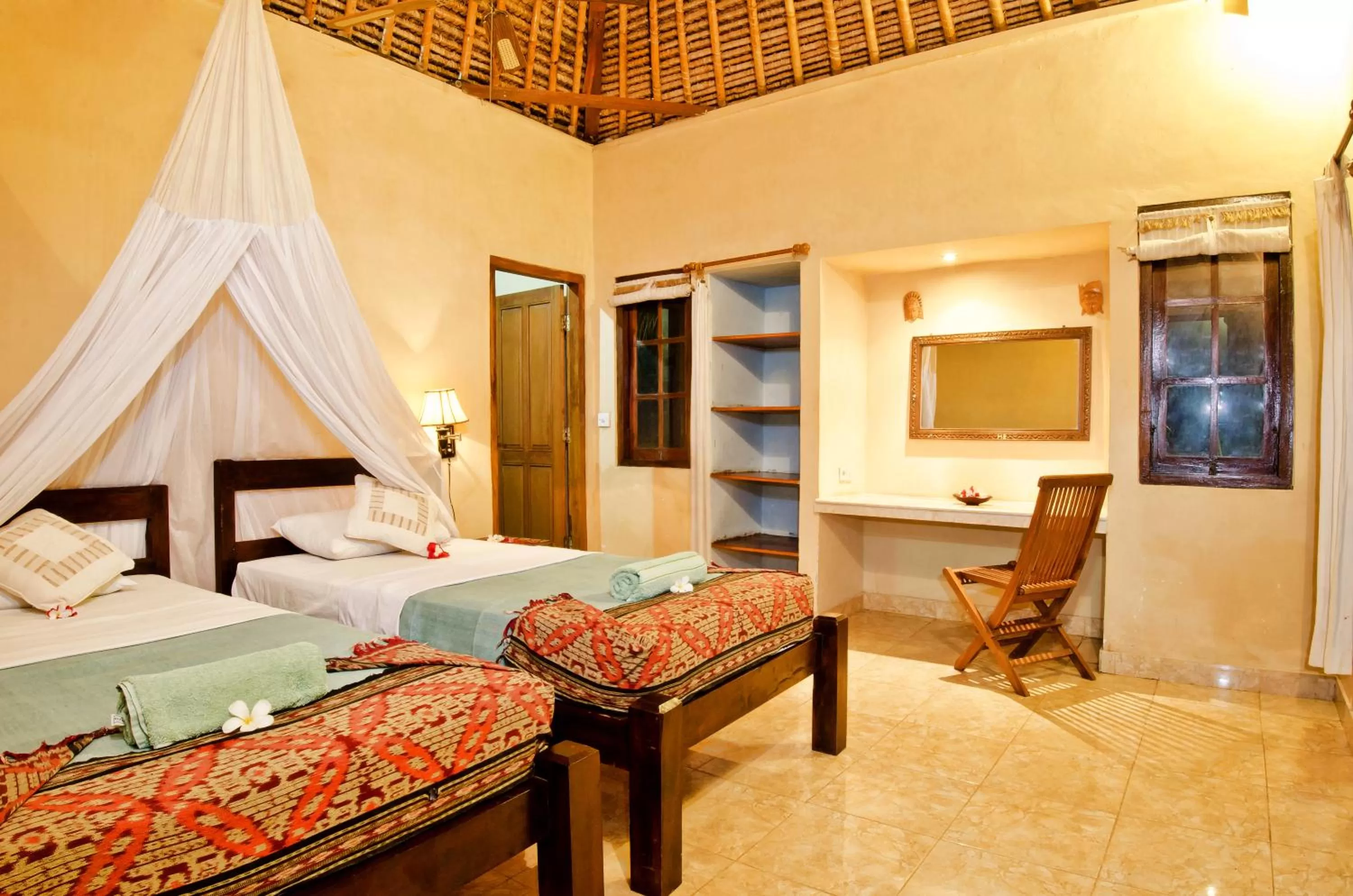 Bed in Mushroom Beach Bungalows