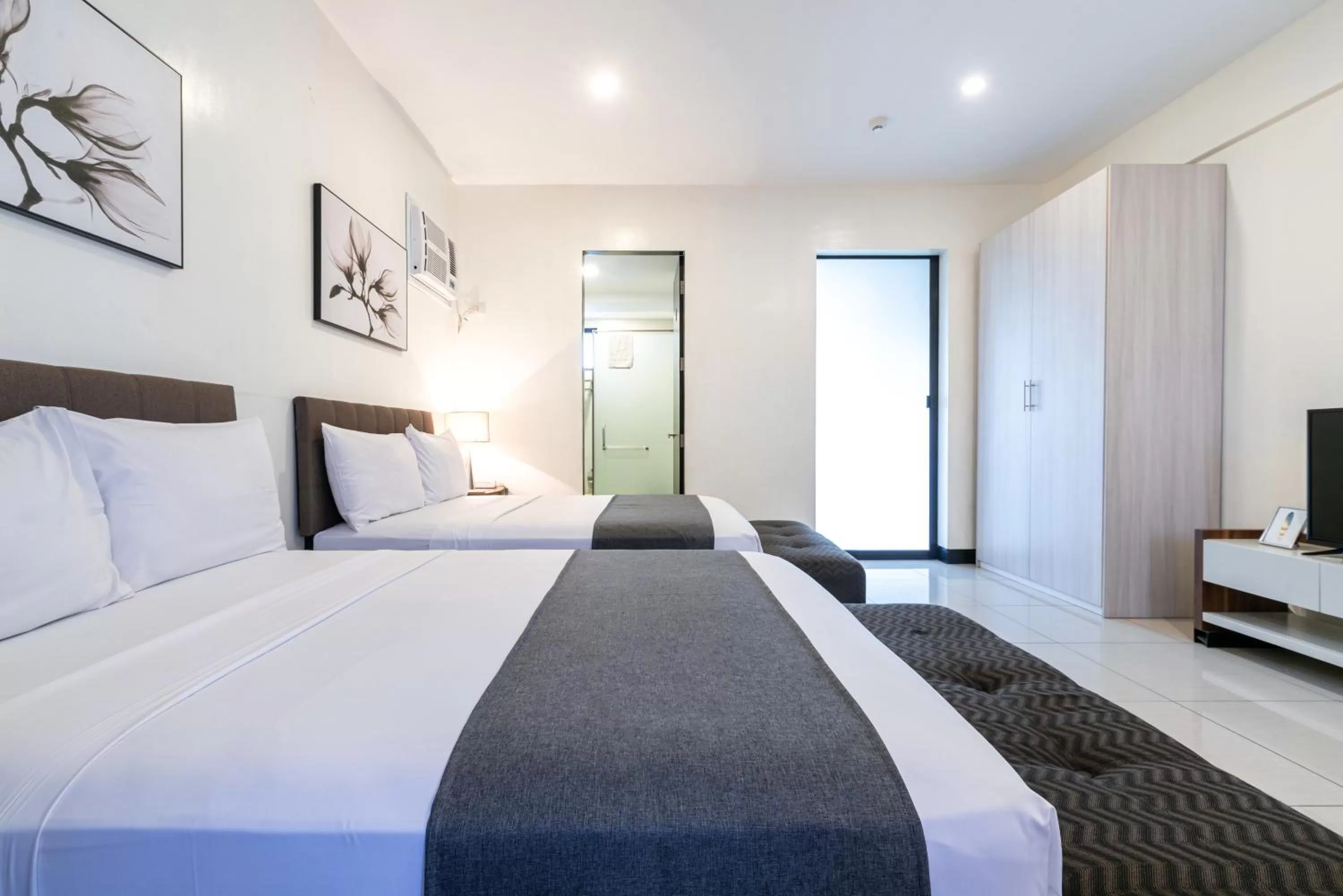 Bedroom, Bed in Artemis Place Makati Hotel