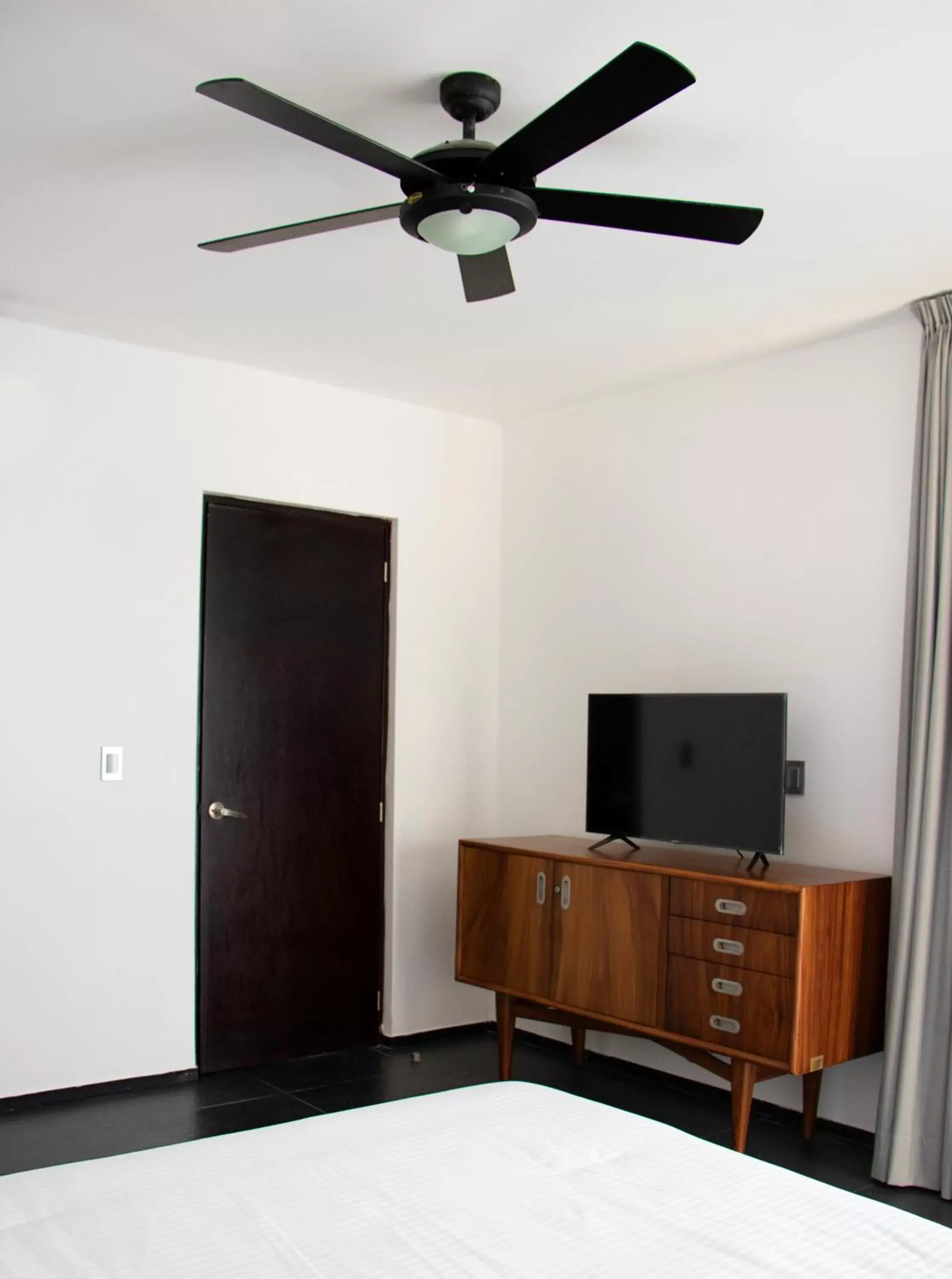 Bedroom, TV/Entertainment Center in Sole Suites