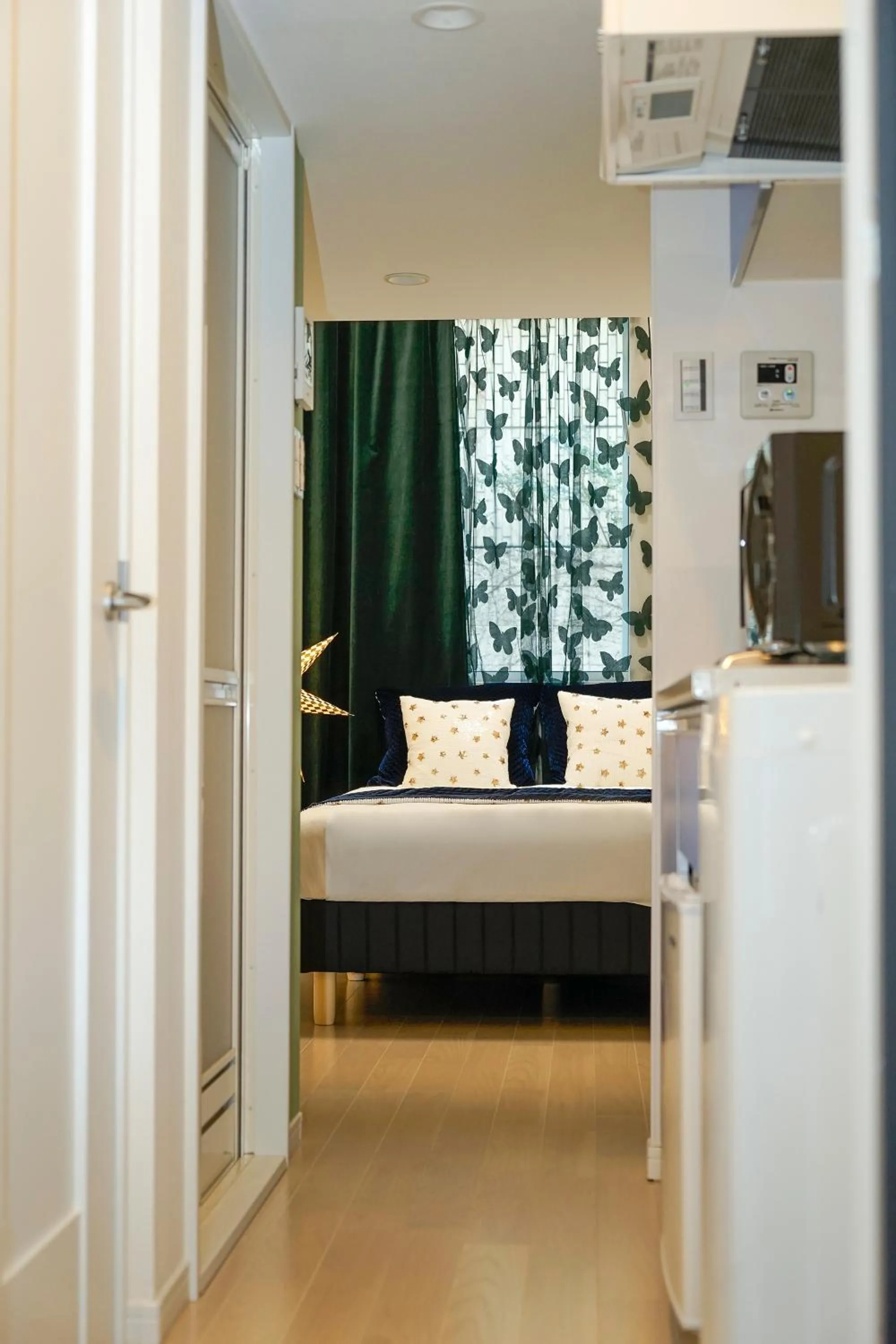 Bed in Blue Empire Hotel