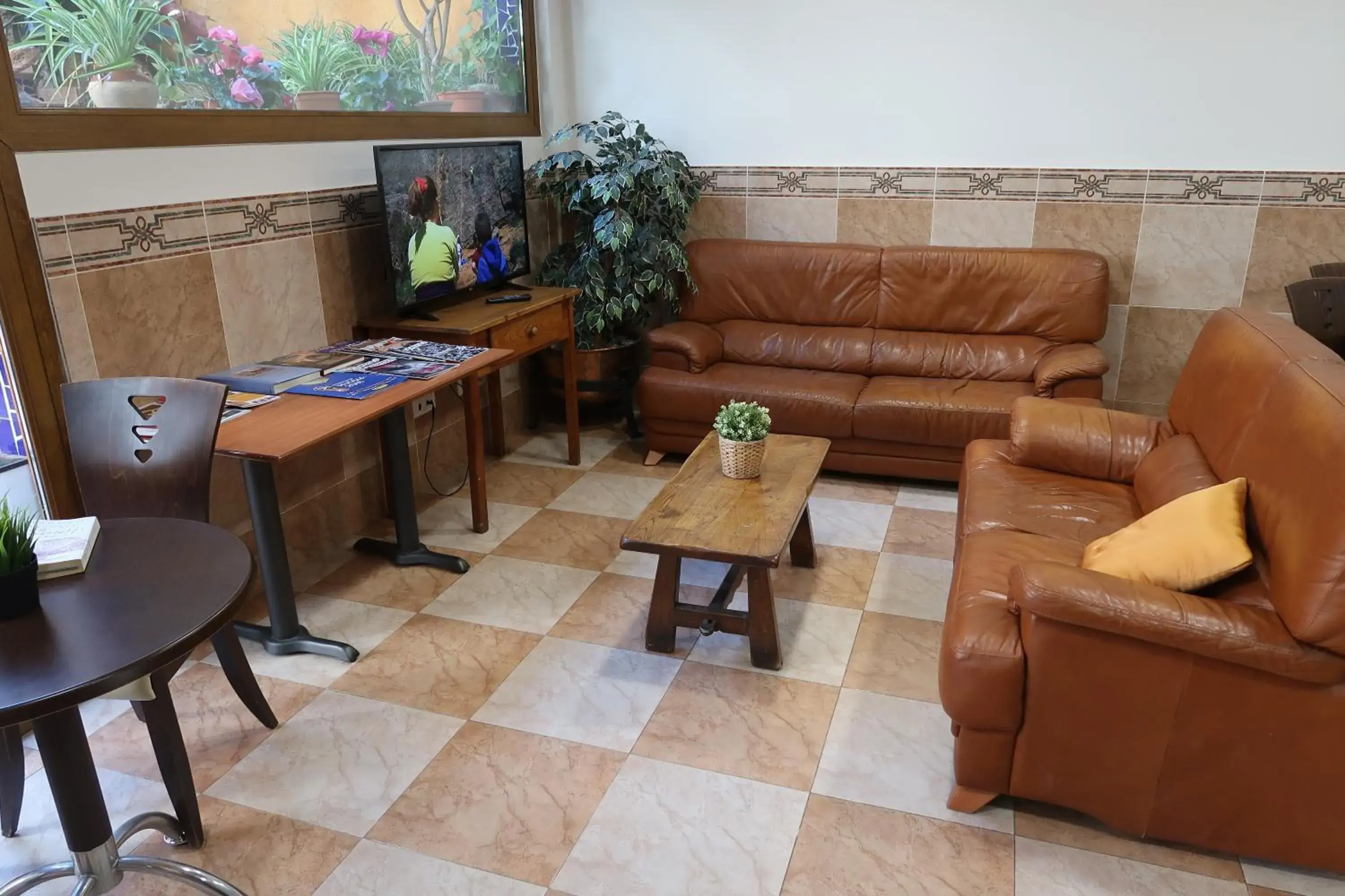 Communal lounge/ TV room, Seating Area in El Cami Hotel