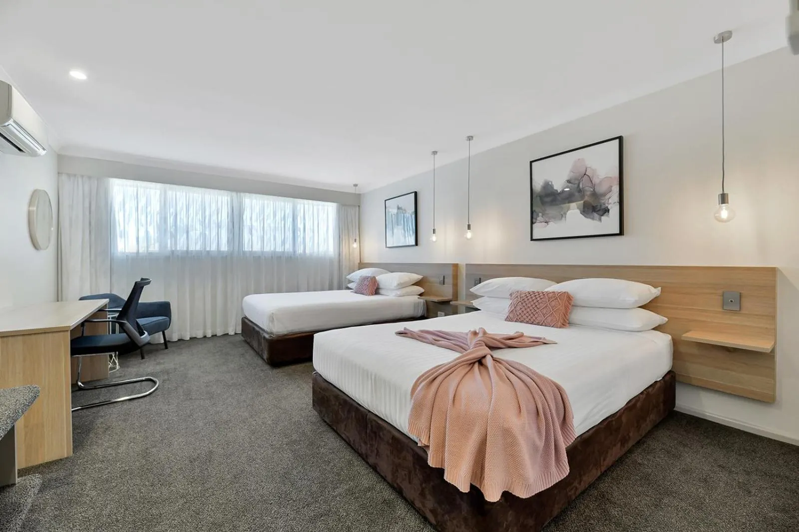 Bed in Central Caleula Motor Lodge