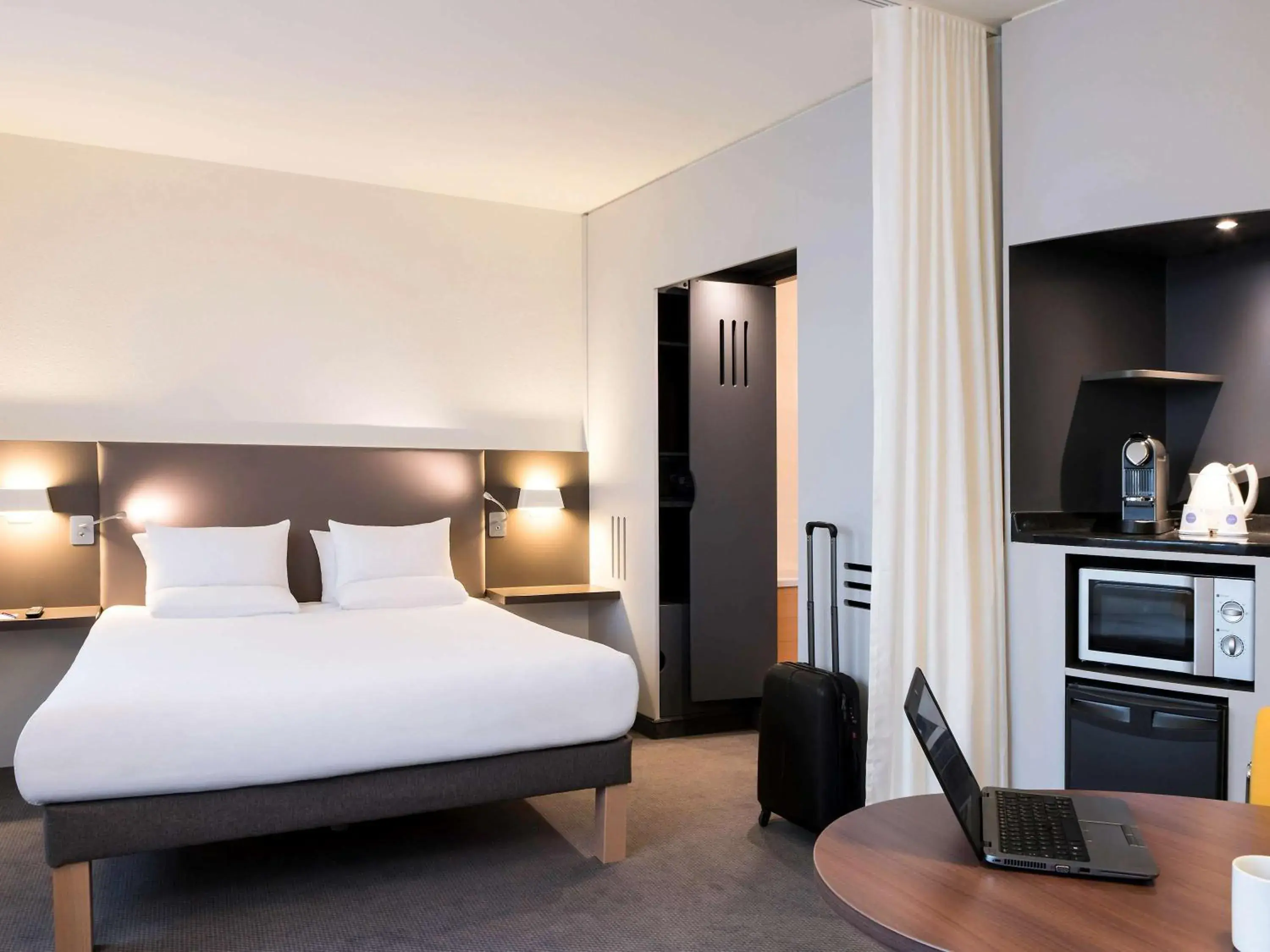 Photo of the whole room, Bed in Novotel Suites Paris Stade de France